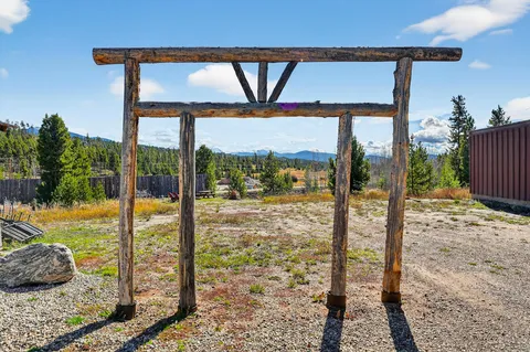 a view of backyard with a table and chairs
