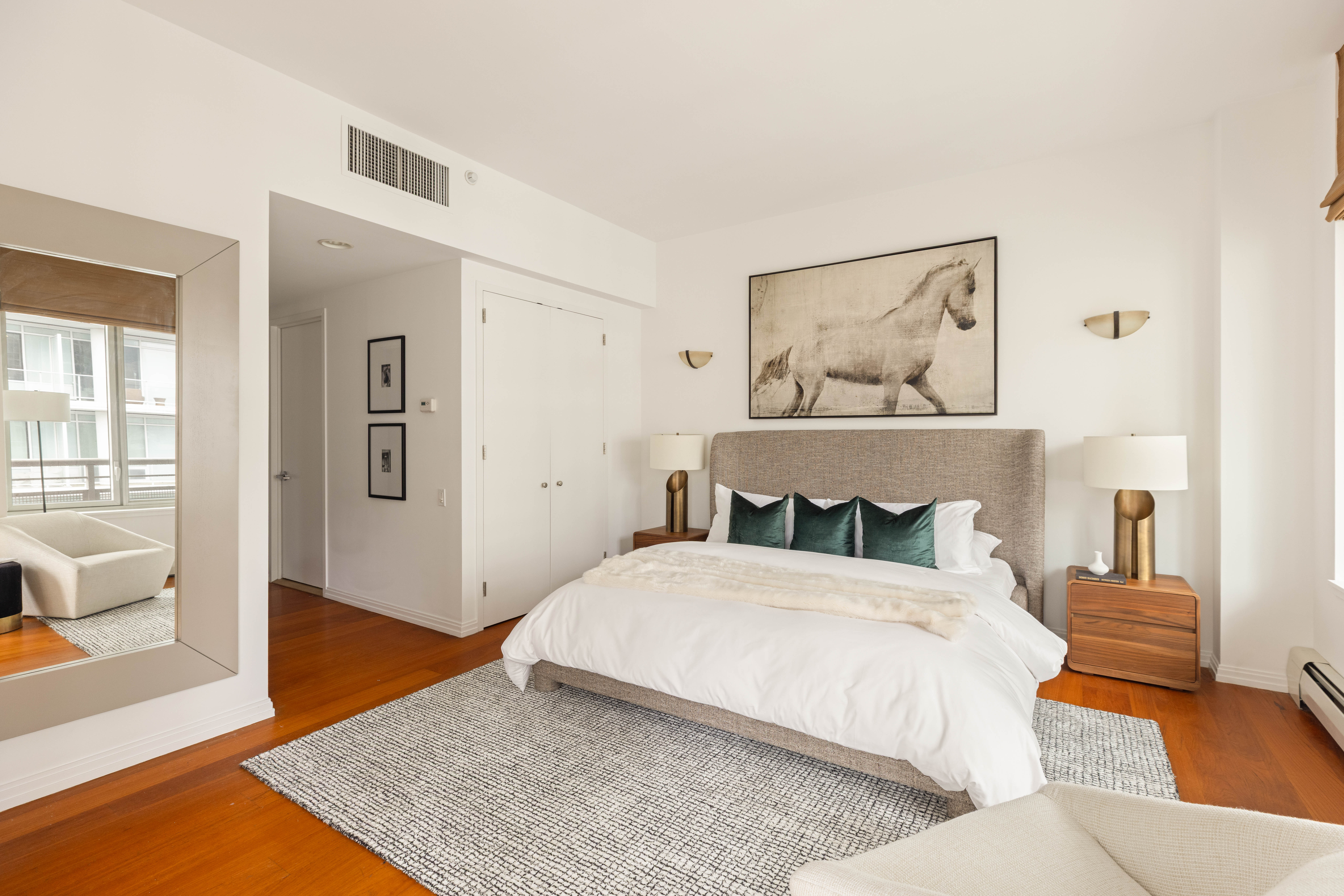 205 East 59th Street, Unit 14B Manhattan, NY 10022 - Photo 13 of 19 a bedroom with a bed and wooden floor