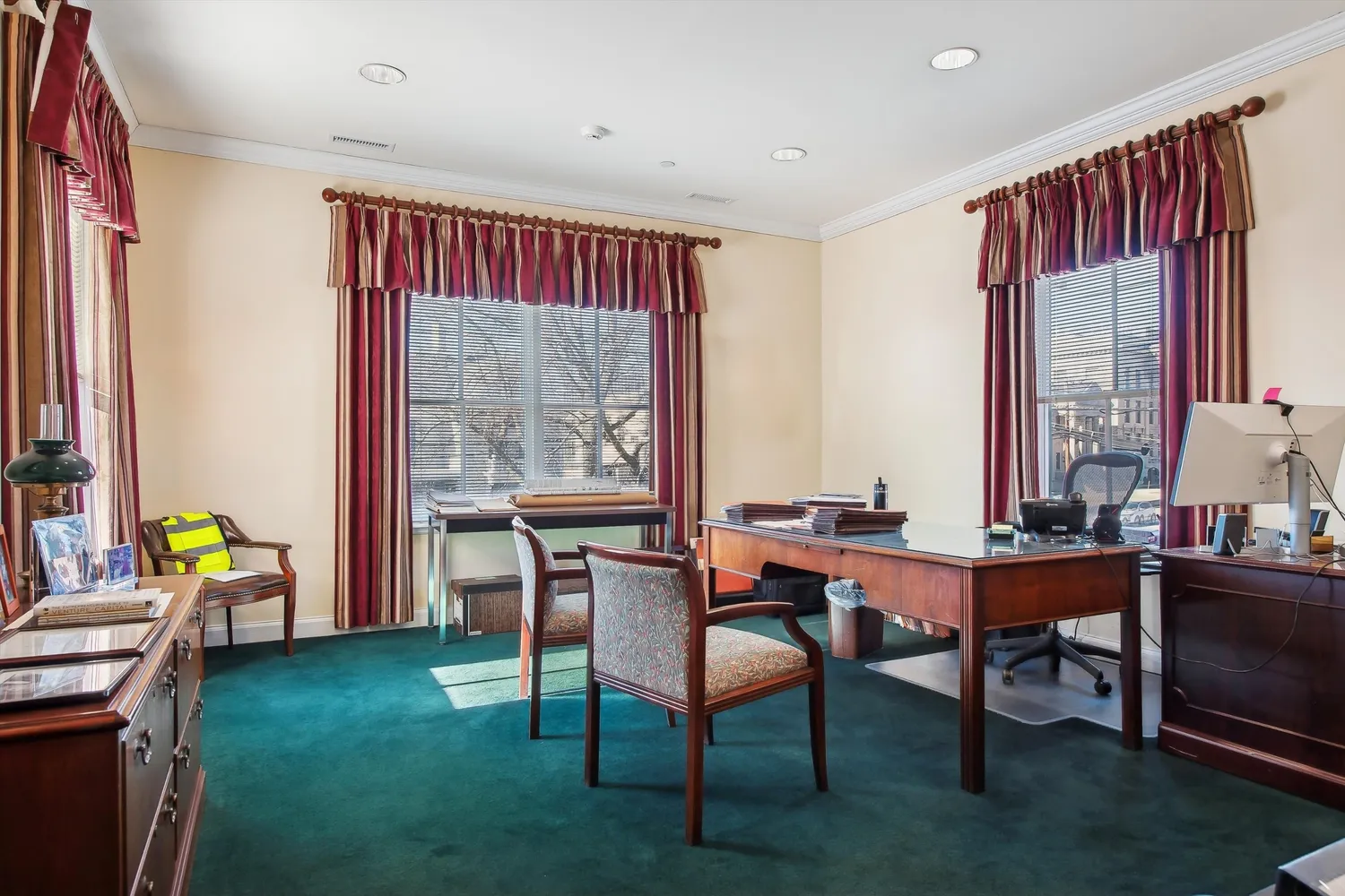 a dining room with furniture window and wooden floor