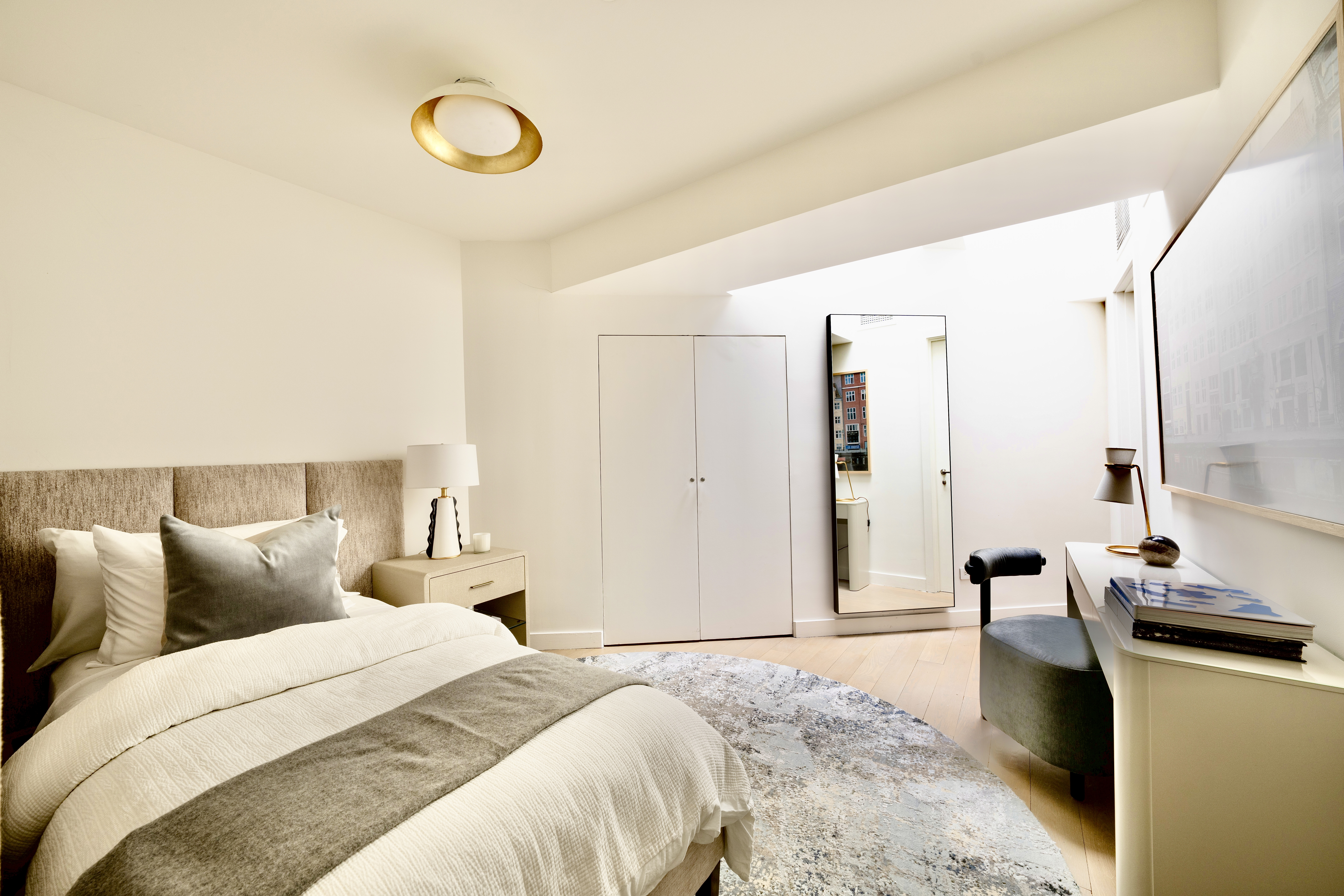 1200 Broadway, Unit PH89 Manhattan, NY 10001 - Photo 31 of 47 a bedroom with a bed and a chair