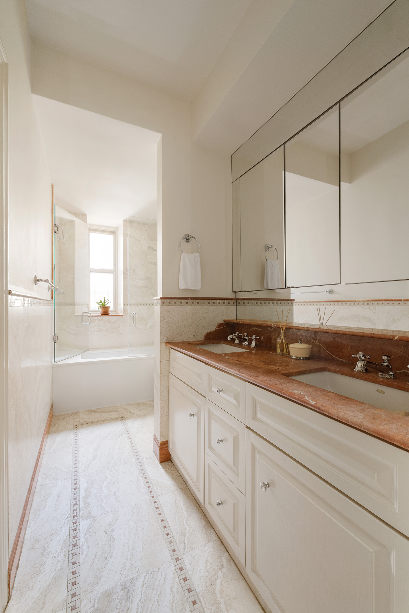 151 West 86th Street, Unit 4D Manhattan, NY 10024 - Photo 10 of 15 a bathroom with a sink and a mirror