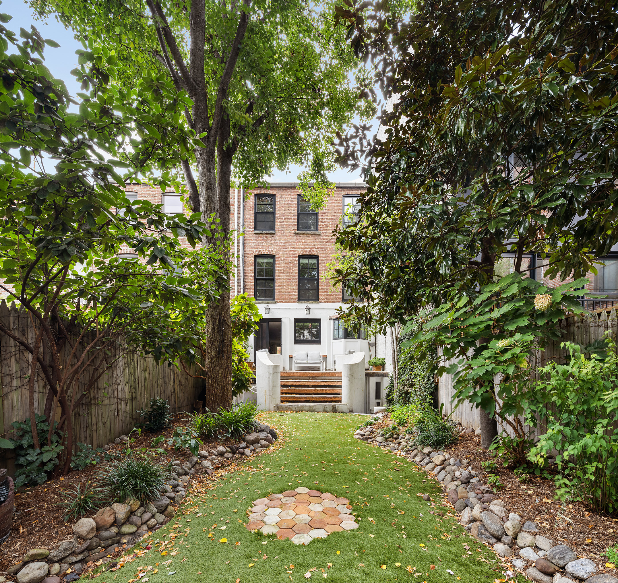 439 Sackett Street Brooklyn, NY 11231 - Photo 14 of 25 a front view of a house with a yard and tree s