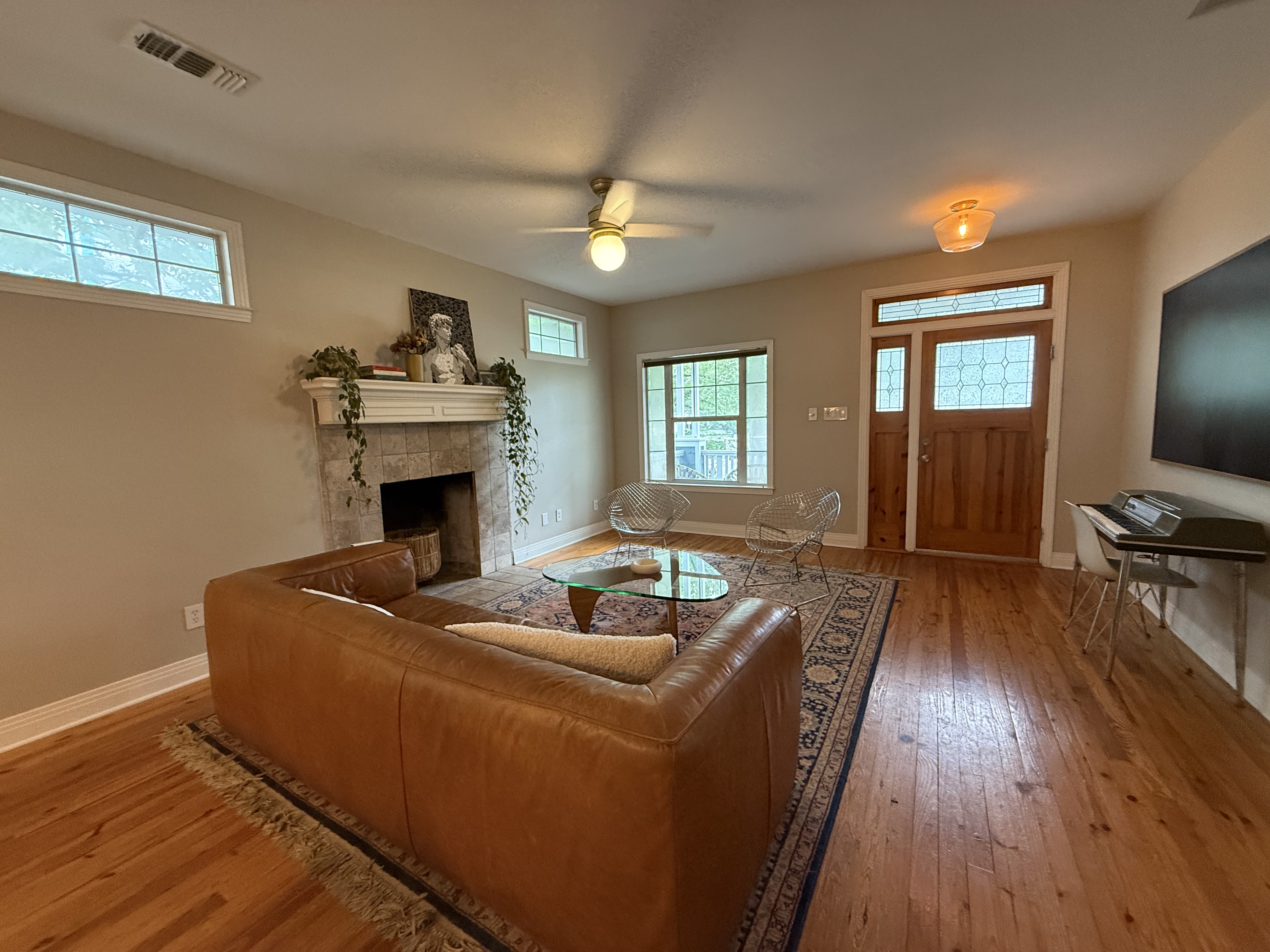 5108 Eilers Avenue Austin, TX 78751 - Photo 4 of 13 a living room with furniture and a fireplace