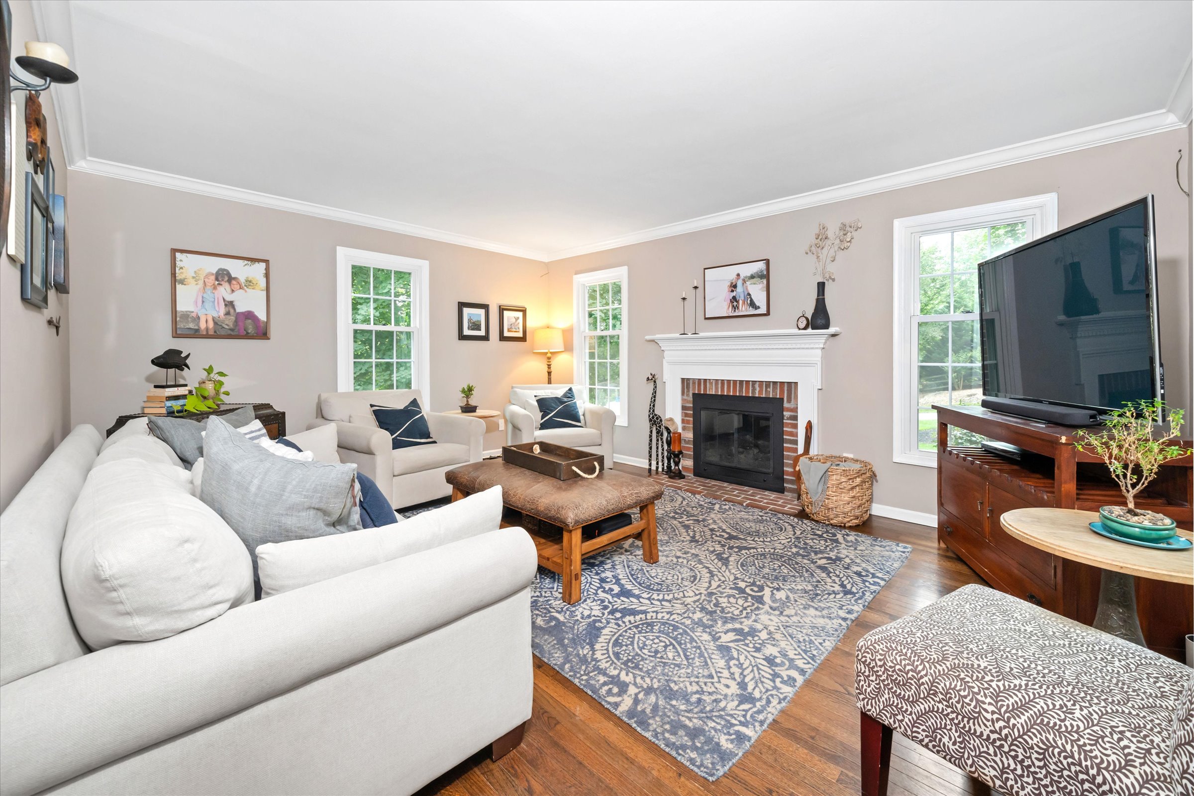 Address Upon Request West Chester, PA 19382 - Photo 5 of 76 a living room with furniture a flat screen tv and a fireplace