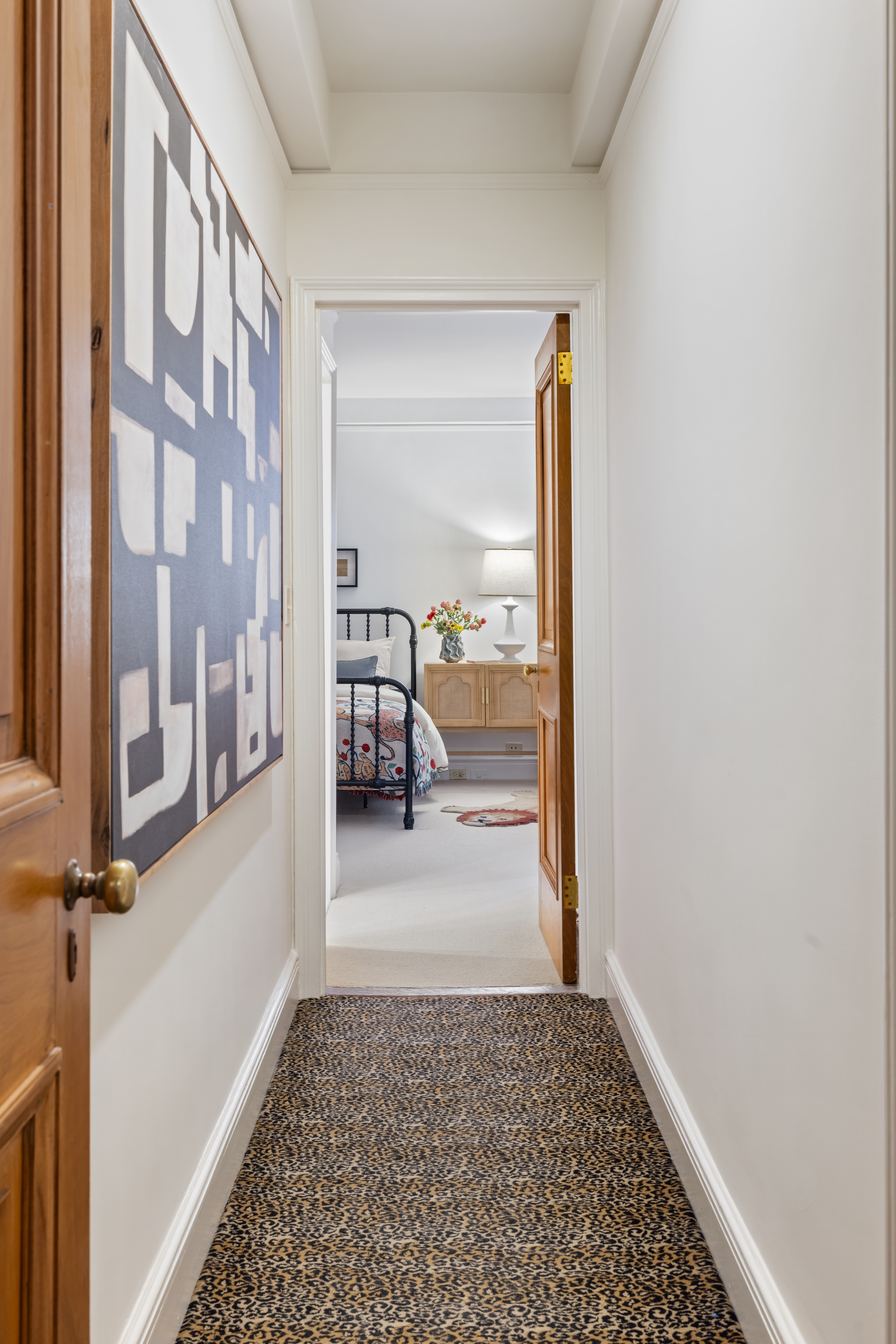 320 East 72nd Street, Unit 5B Manhattan, NY 10021 - Photo 12 of 18 a view of a hallway with a livingroom and furniture