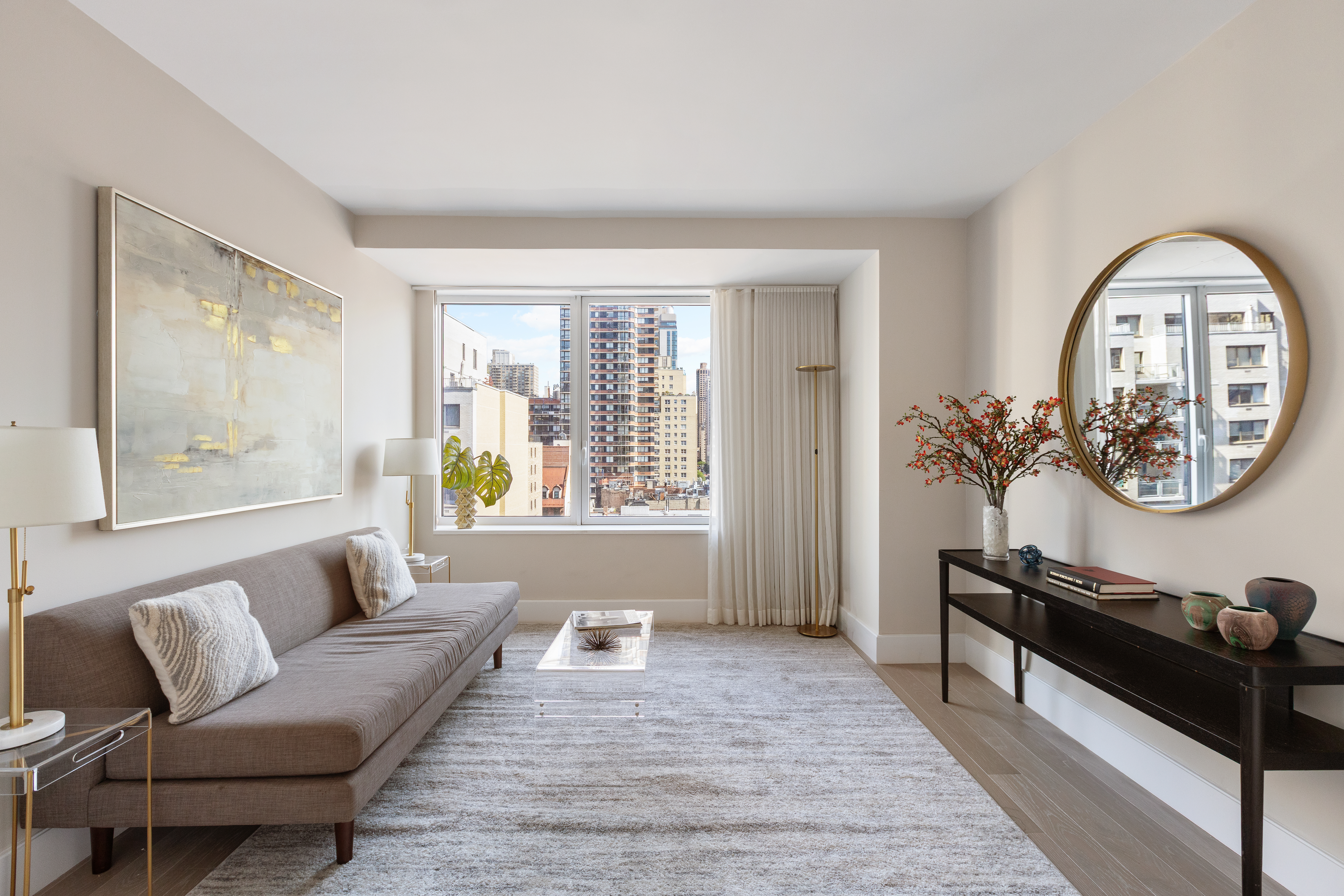 1355 1st Avenue, Unit 8 Manhattan, NY 10021 - Photo 22 of 25 a living room with furniture and a window