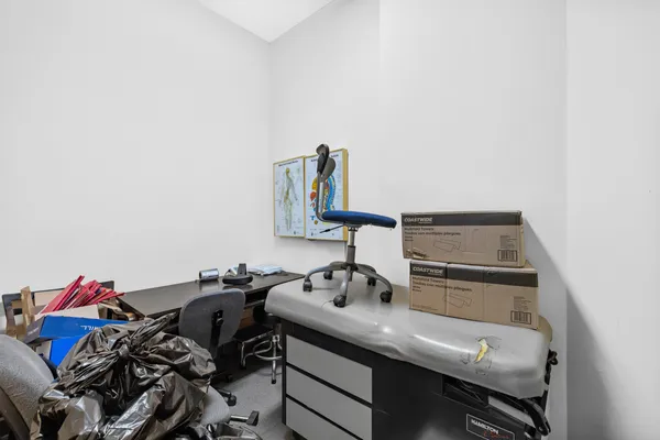 a view of a workspace with furniture