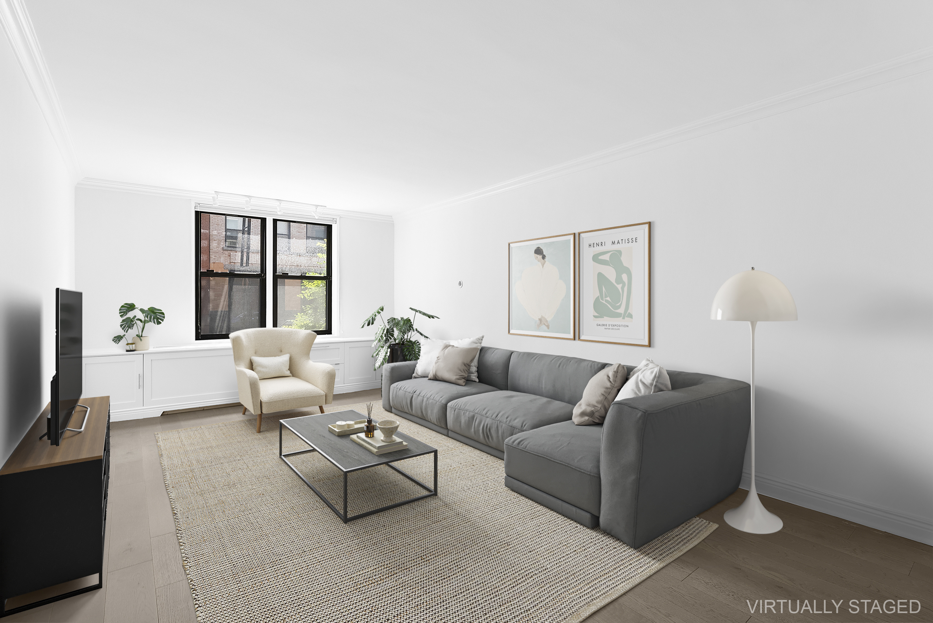 100 Bank Street, Unit 1H Manhattan, NY 10014 - Photo 2 of 10 a living room with furniture and a flat screen tv