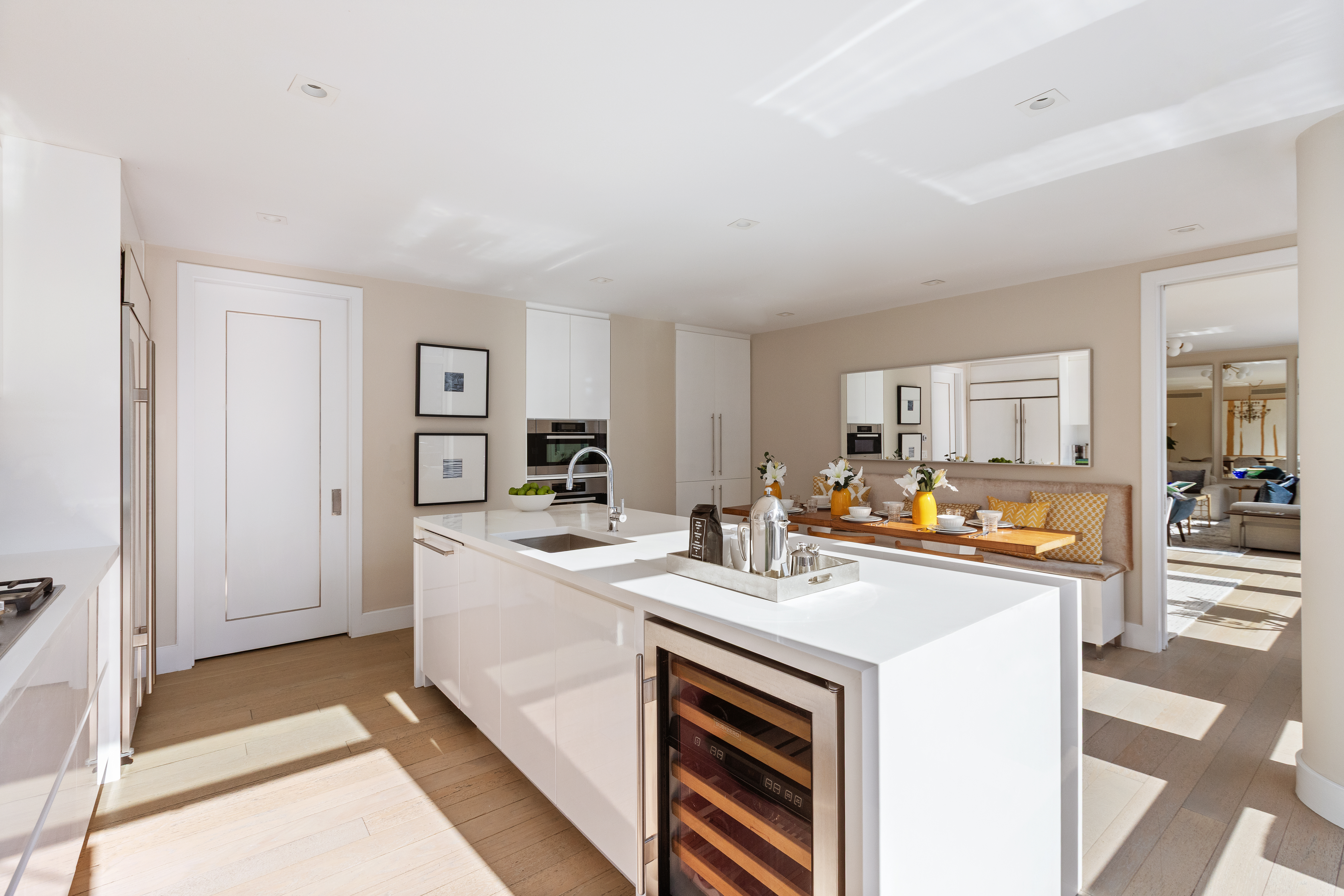 1355 1st Avenue, Unit 8 Manhattan, NY 10021 - Photo 8 of 25 a kitchen that has a lot of white cabinets and stainless steel appliances