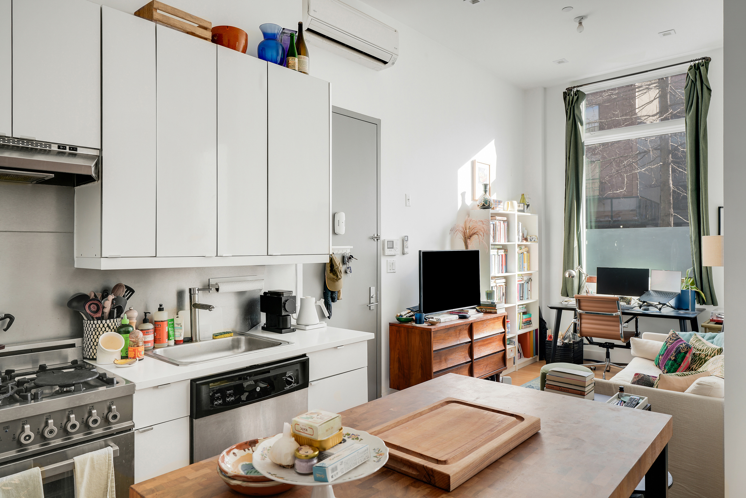 622 Grand Avenue, Unit 102 Brooklyn, NY 11238 - Photo 6 of 13 a kitchen with stainless steel appliances a stove a sink dishwasher and cabinets with wooden floor