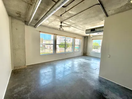 a bathroom with a sink a toilet a mirror and shower