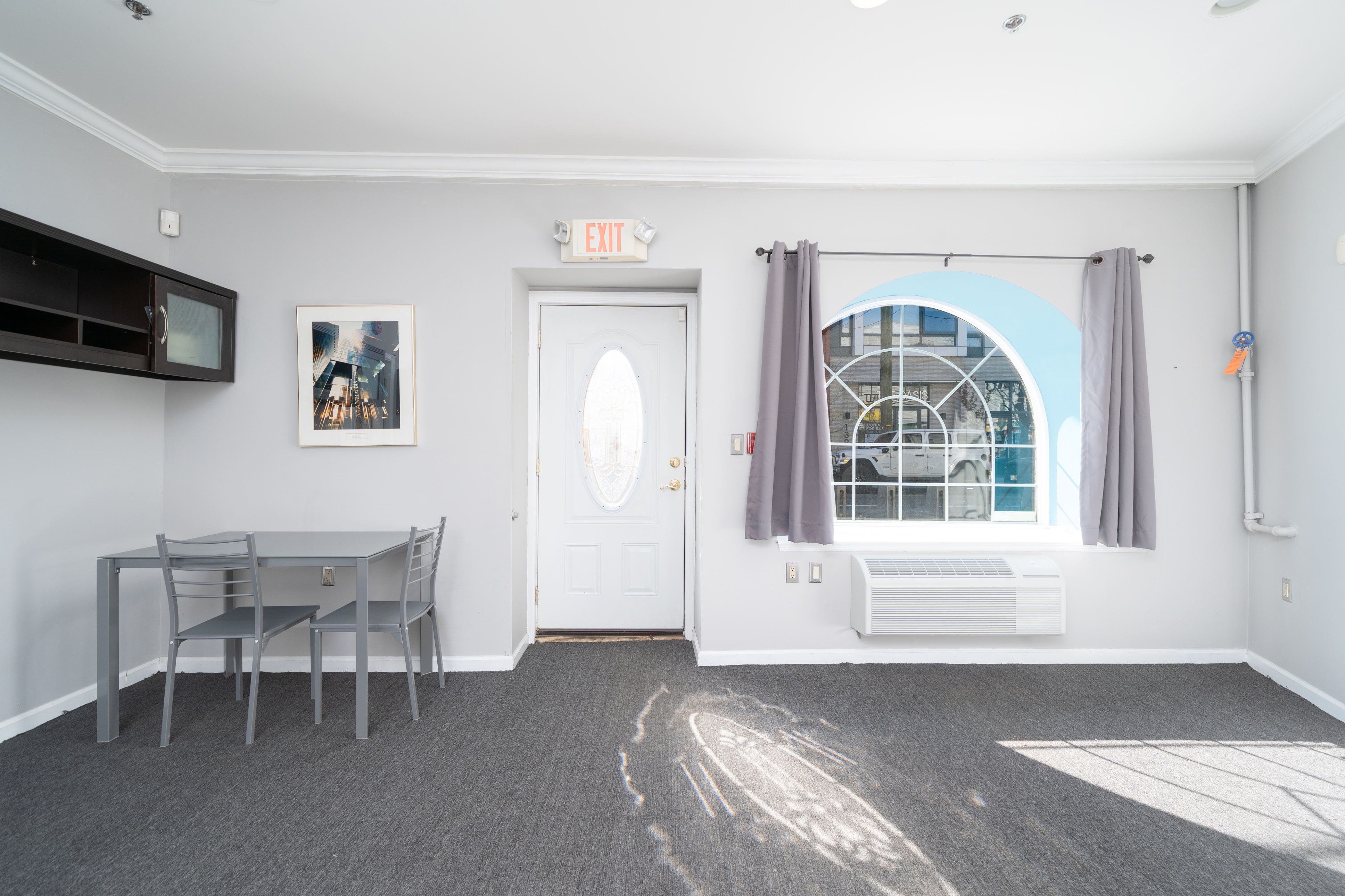 354 3rd Street Jersey City, NJ 07302 - Photo 6 of 15 a view of a livingroom with furniture and a window