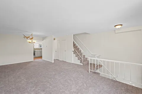 a view of a hallway with staircase