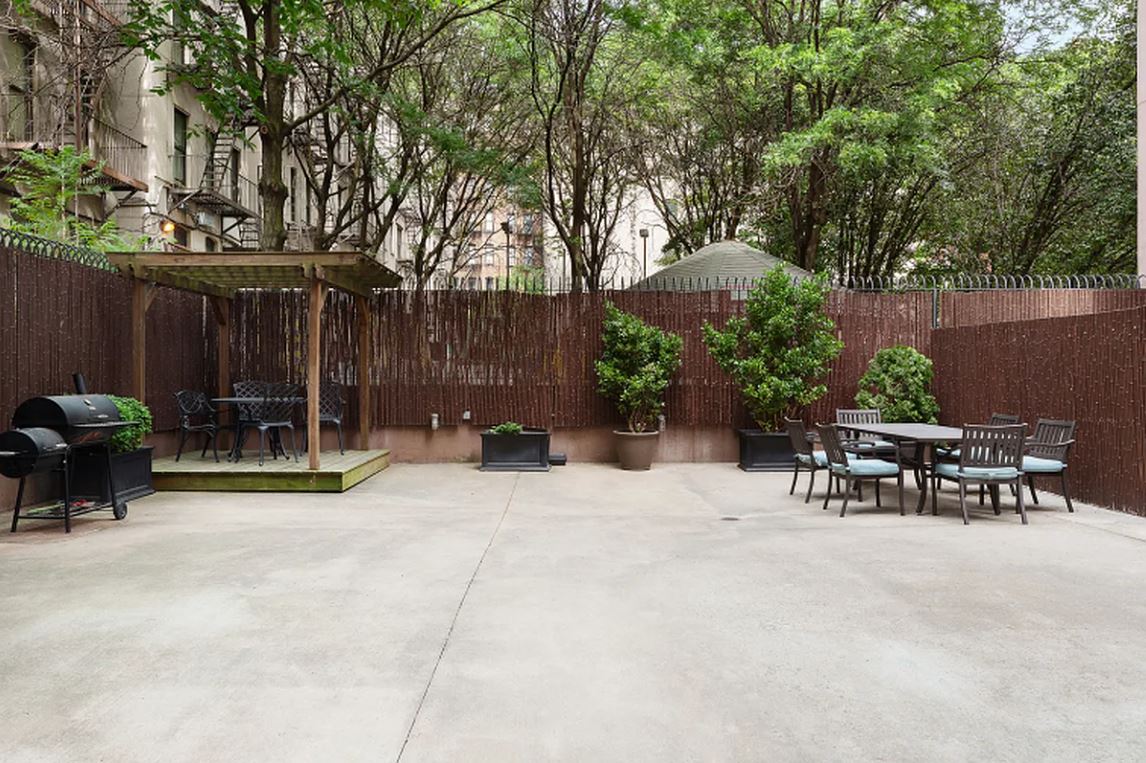 1810 3rd Avenue, Unit 9D Manhattan, NY 10029 - Photo 8 of 10 a view of table and chairs in patio