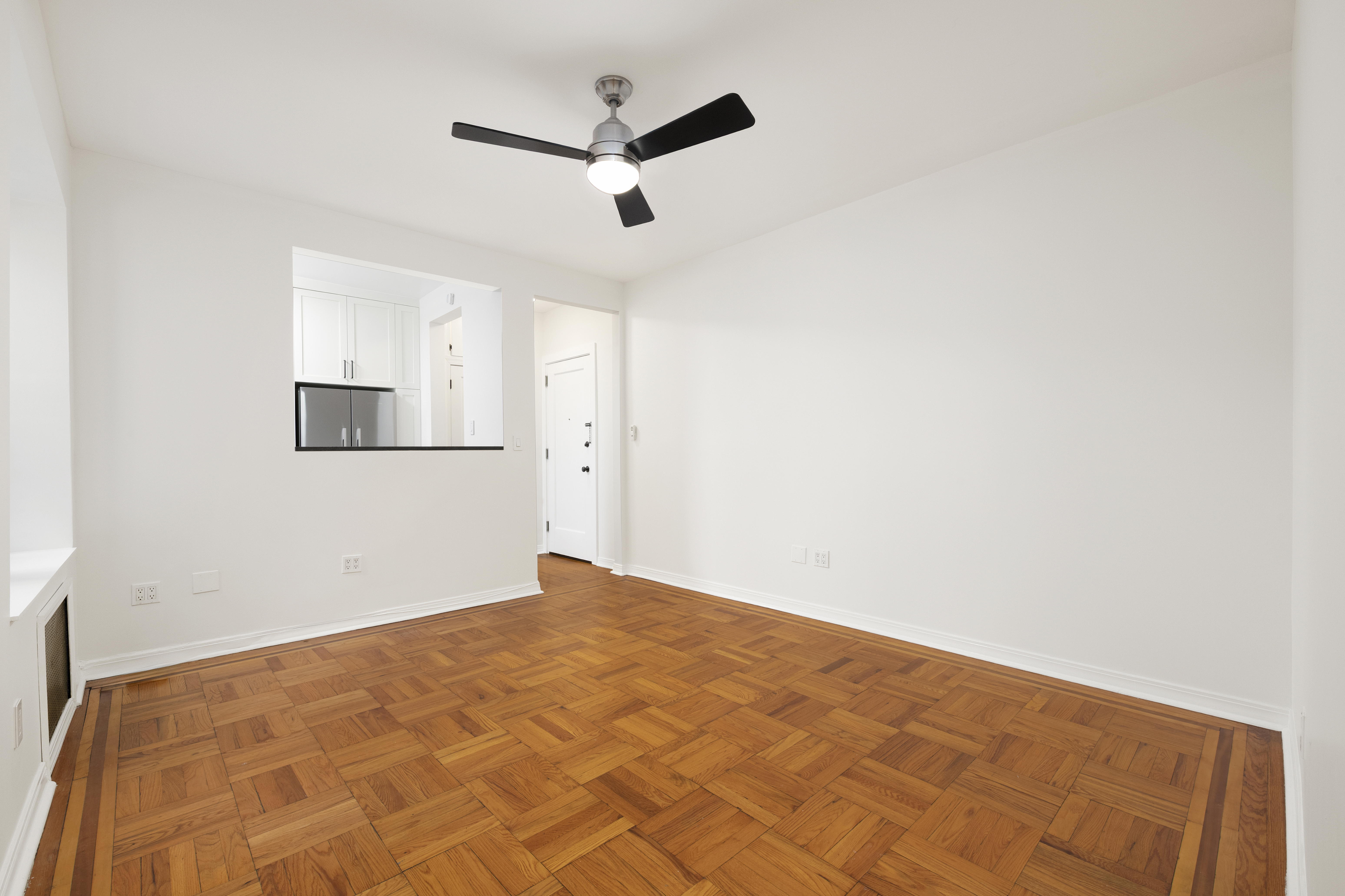 67 Morton Street, Unit 2A Manhattan, NY 10014 - Photo 4 of 10 a view of empty room with wooden floor