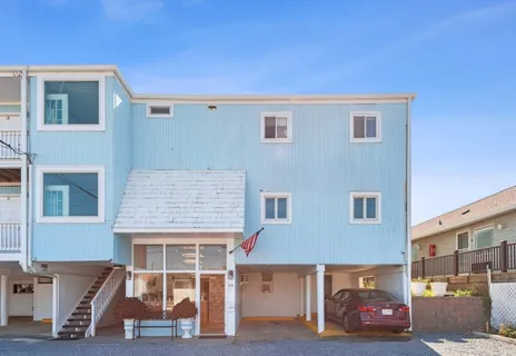 a view of a swimming pool and lounge chairs