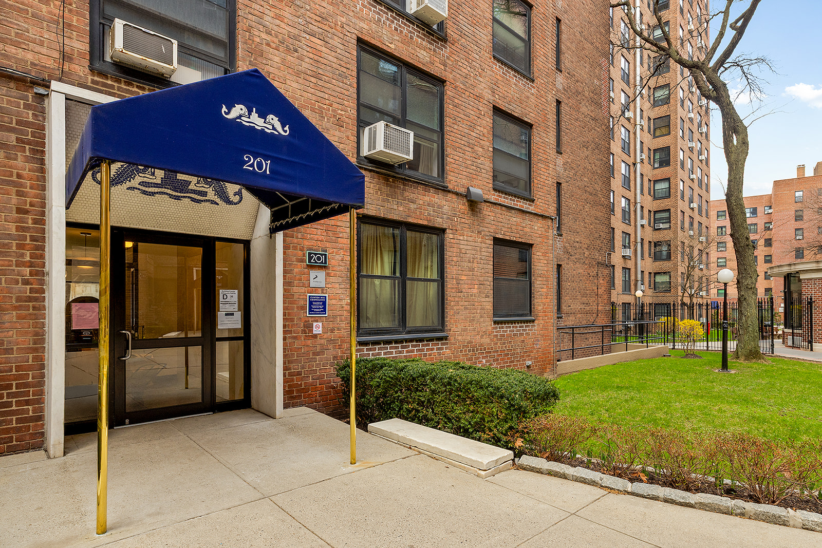 201 Clinton Avenue, Unit 6F Brooklyn, NY 11205 - Photo 6 of 7 a view of a brick building with many windows
