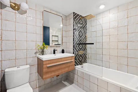 a bathroom with a bathtub and sink