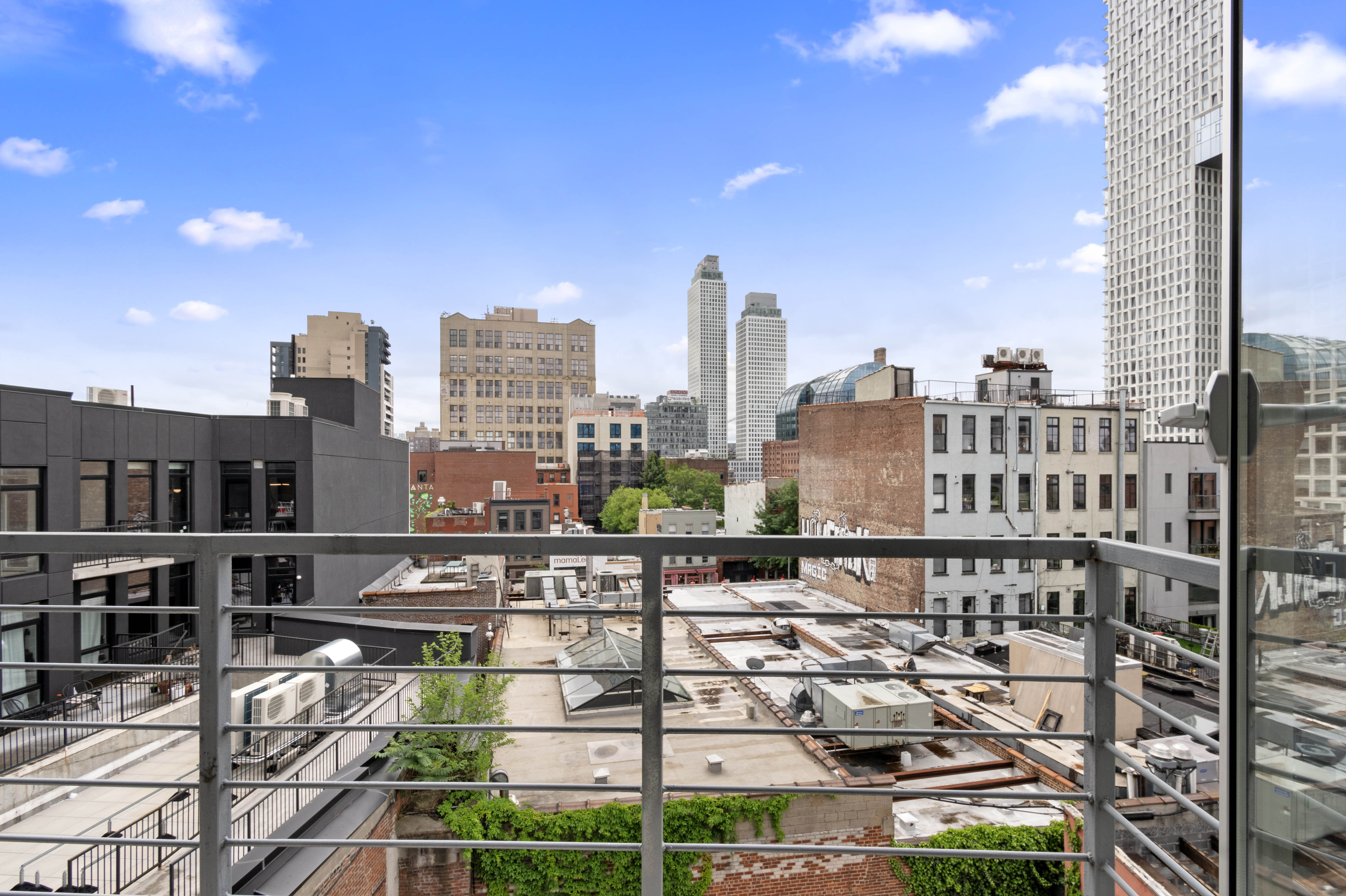 66 North 1st Street, Unit 4D Brooklyn, NY 11249 - Photo 6 of 9 a view of a city with tall buildings