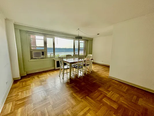 900 West 190th Street, Unit 9B Manhattan, NY 10040 - Photo 5 of 16 a view of a dining room with furniture window and outside view