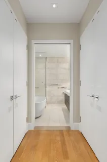 a bathroom with a tub and shower