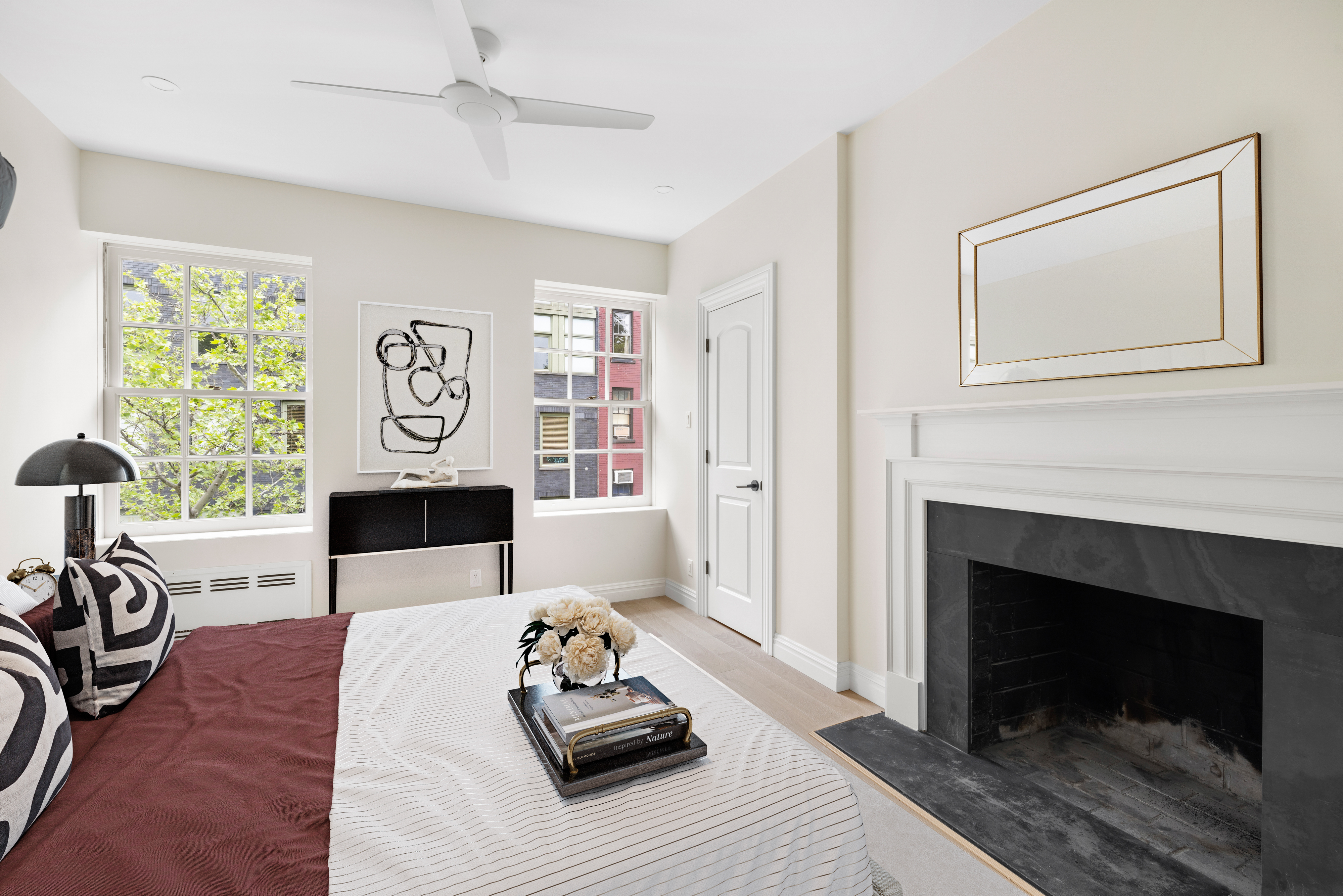 178 Sullivan Street, Unit 2A Manhattan, NY 10012 - Photo 11 of 19 a living room with furniture and a fireplace