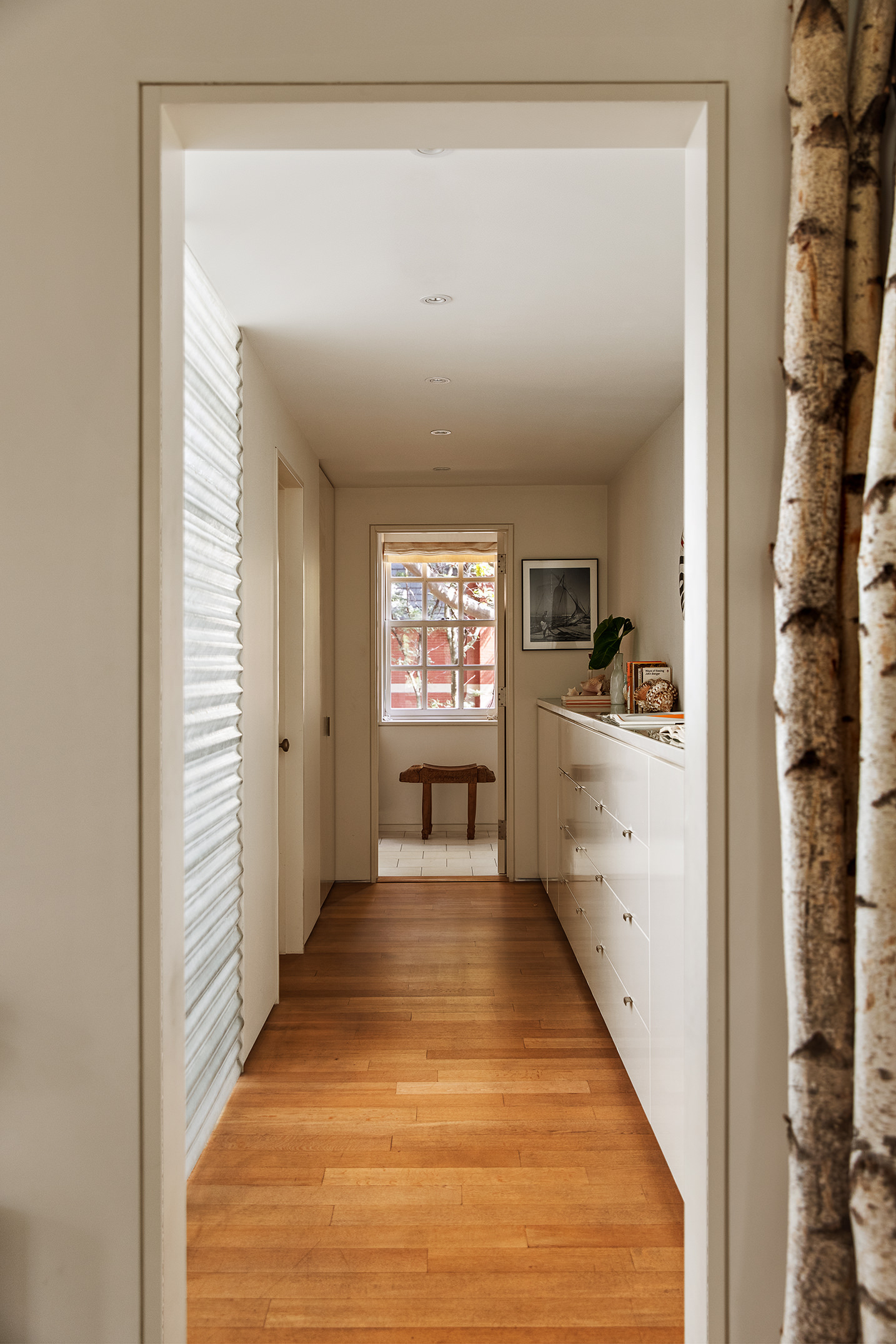 12 Sidney Place Brooklyn, NY 11201 - Photo 27 of 36 a view of a hallway with wooden floor and furniture