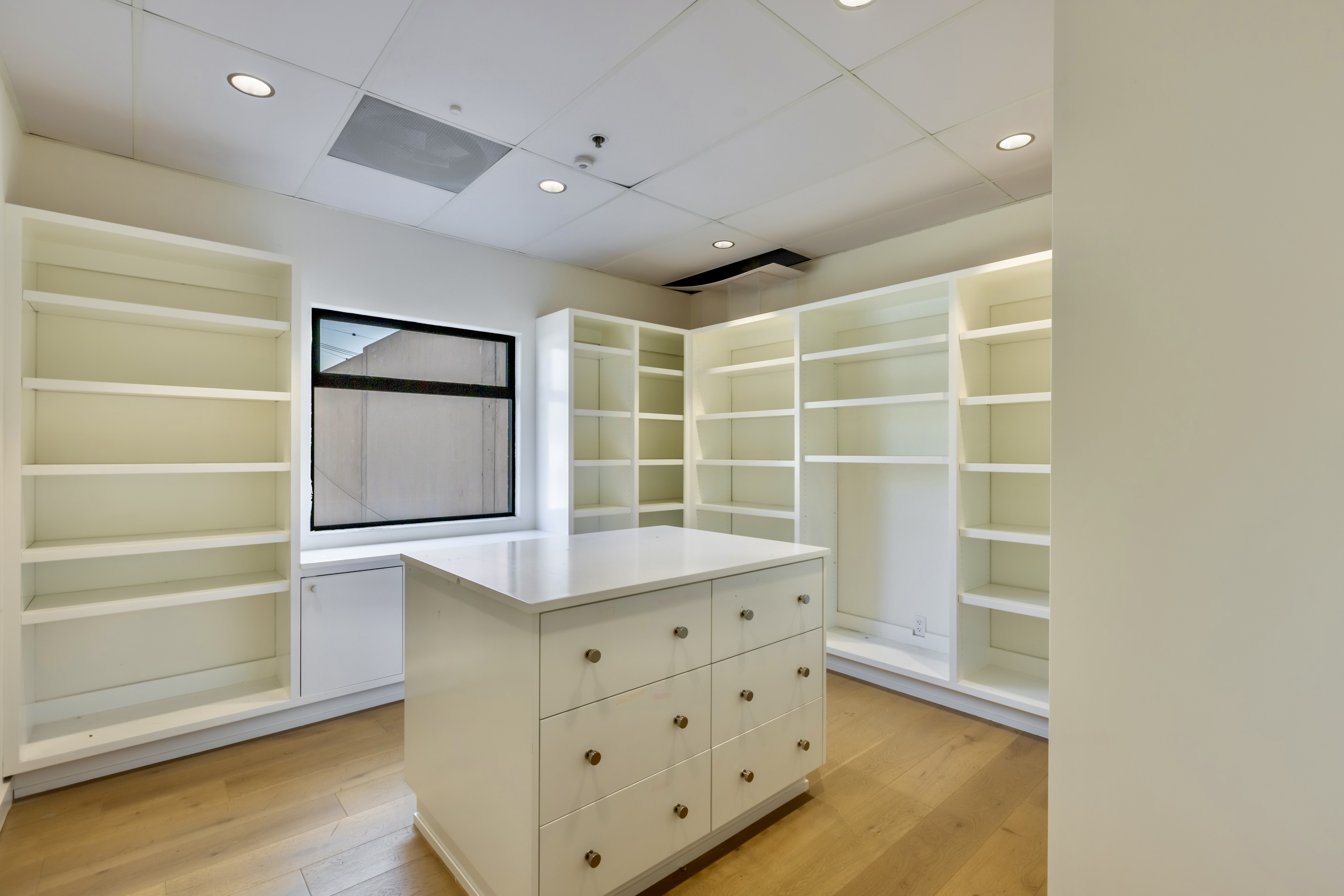 3058 North Lima Street Burbank, CA 91504 - Photo 34 of 41 a view of walk in closet with empty racks