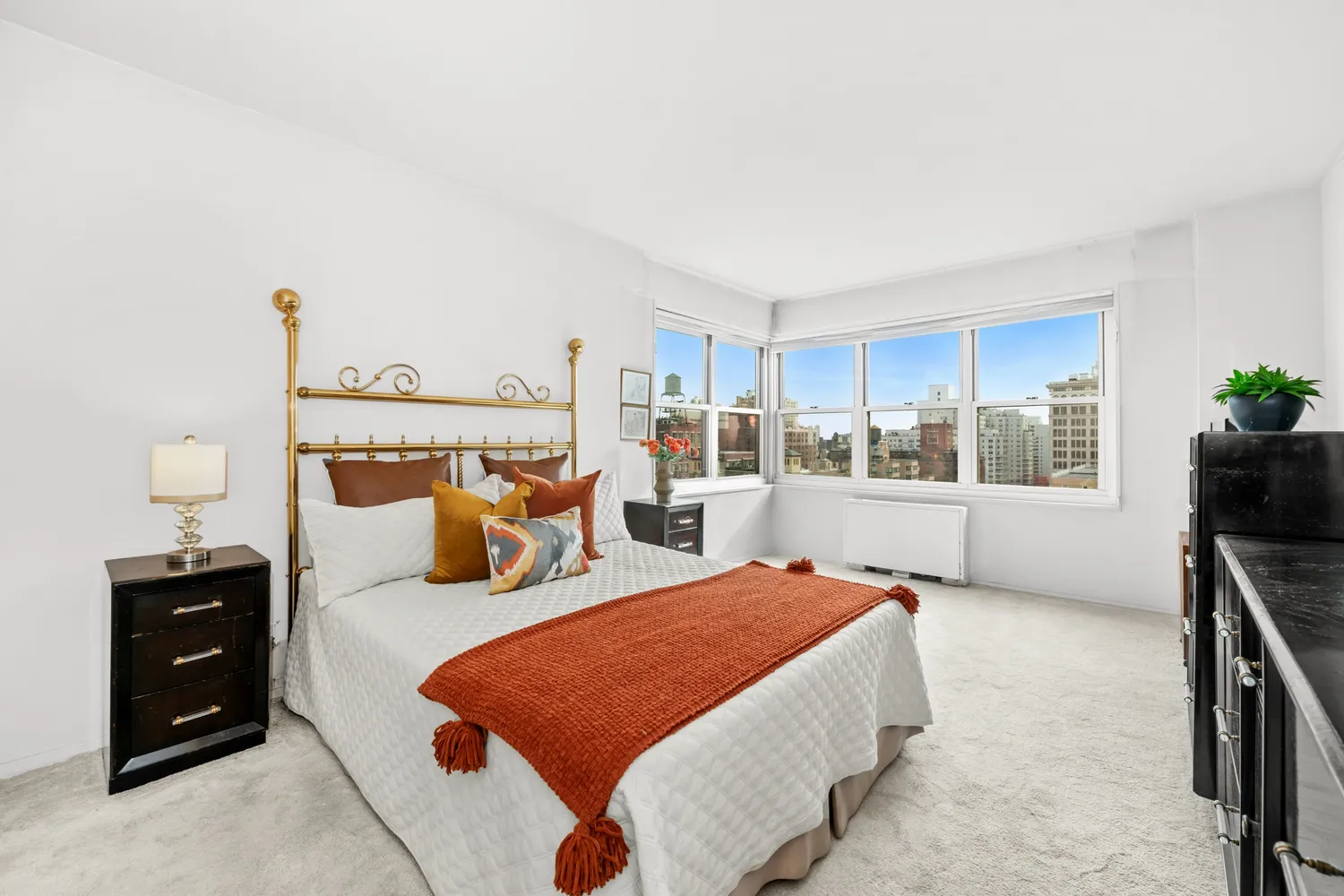 a bedroom with furniture and a window