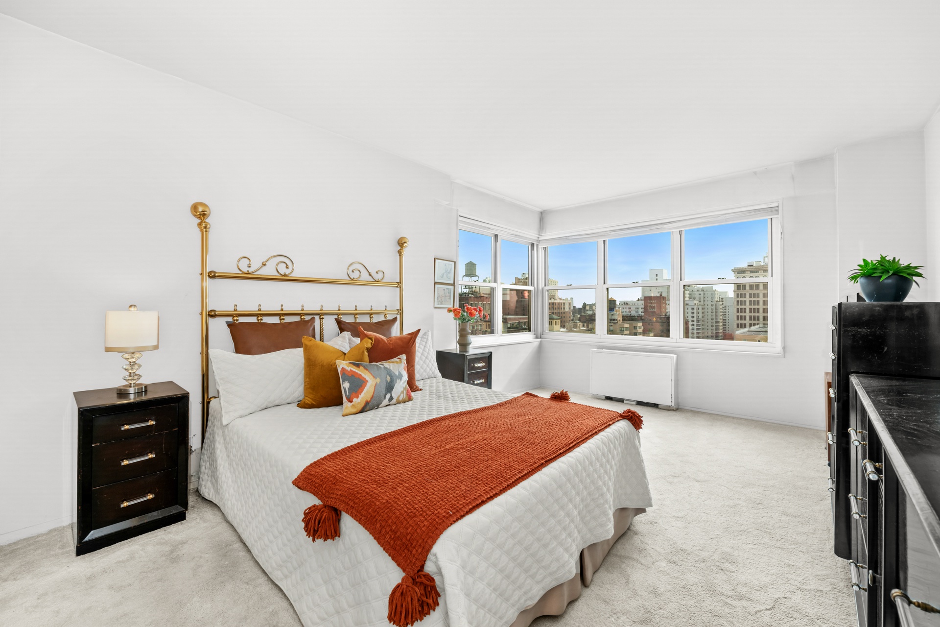 20 East 9th Street, Unit 18E Manhattan, NY 10003 - Photo 18 of 40 a bedroom with furniture and a window