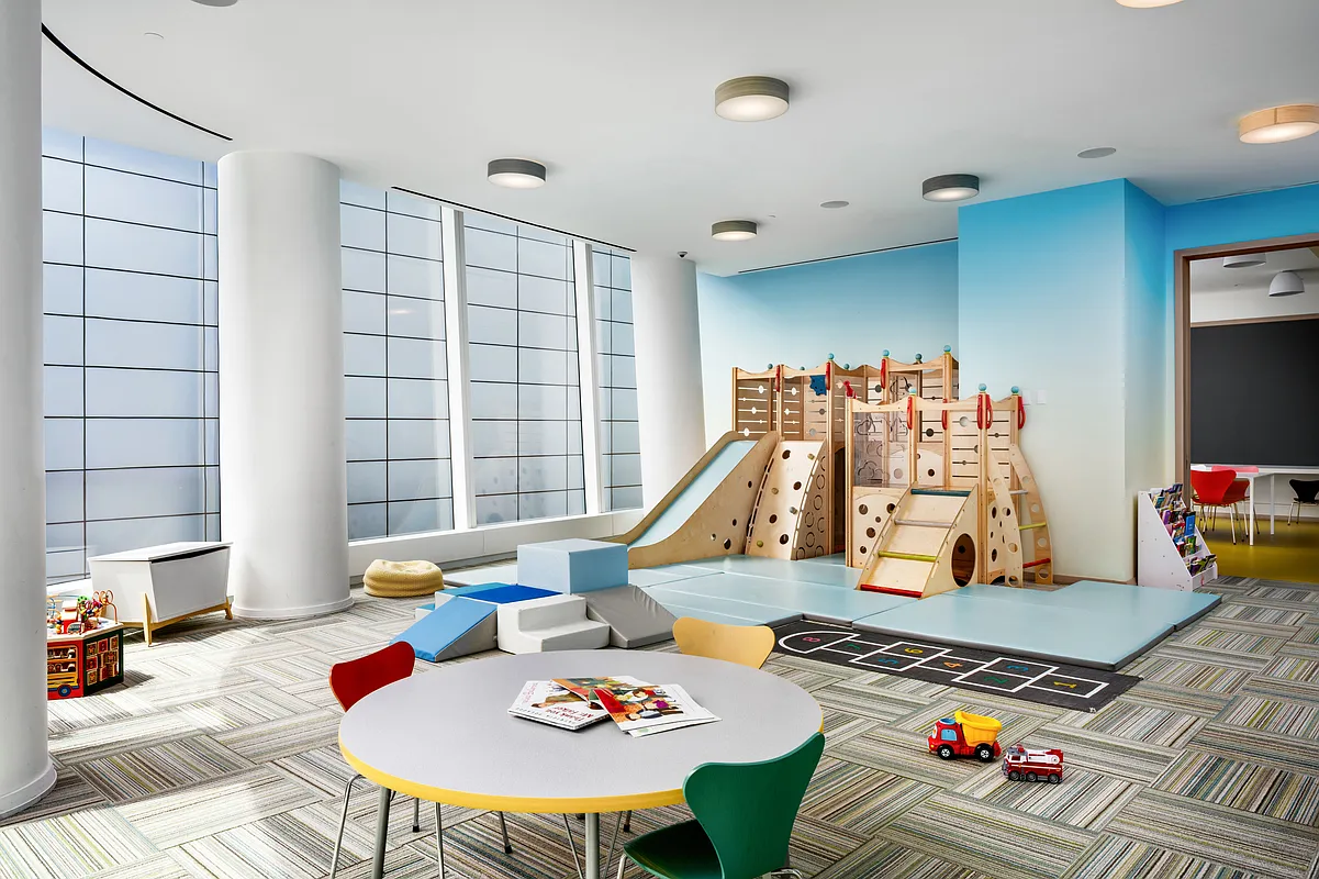 50 West Street, Unit 30B Manhattan, NY 10006 - Photo 24 of 25 a living room with furniture and a flat screen tv