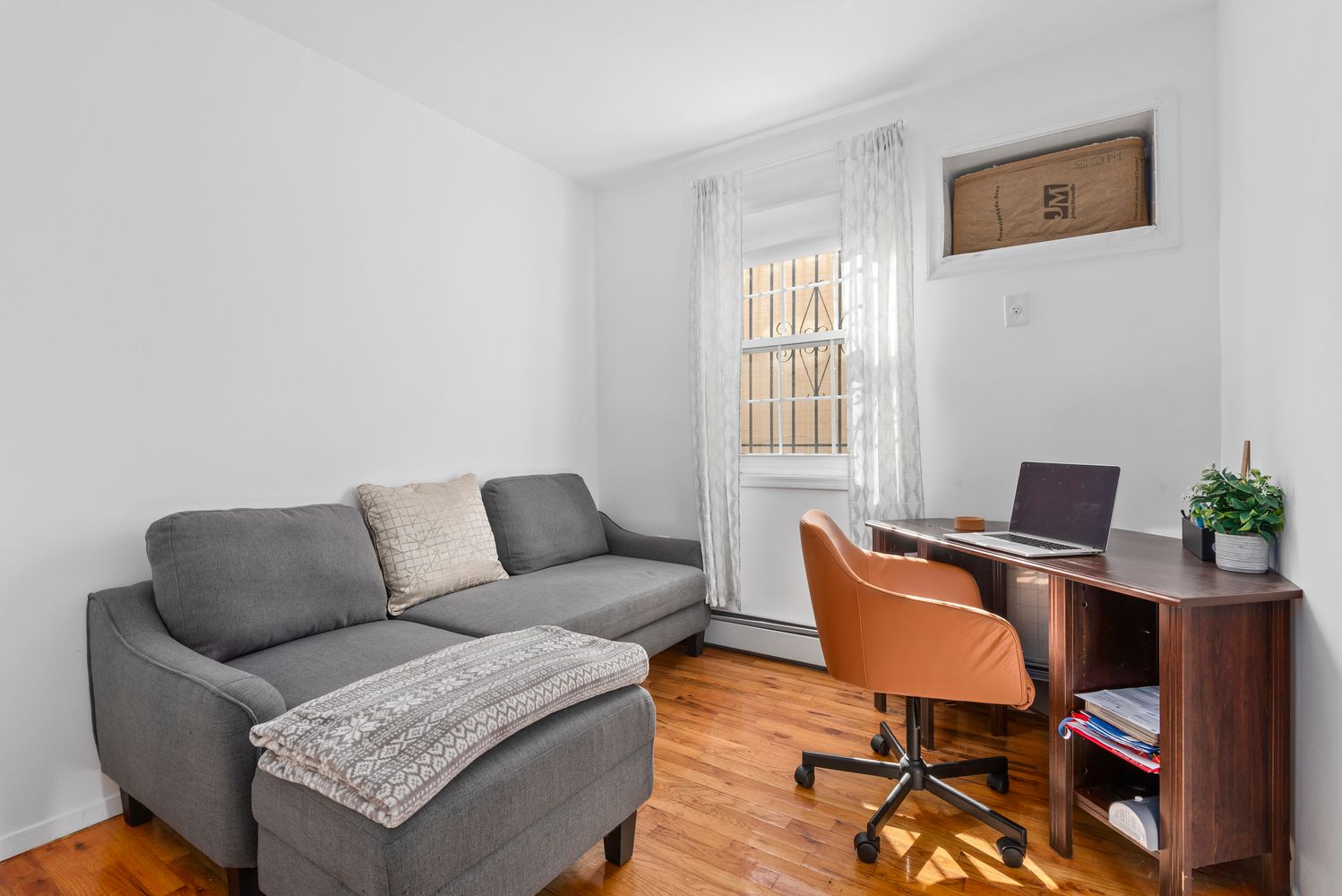 756 Barbey Street, Unit 1A Brooklyn, NY 11207 - Photo 4 of 9 a living room with furniture and a window