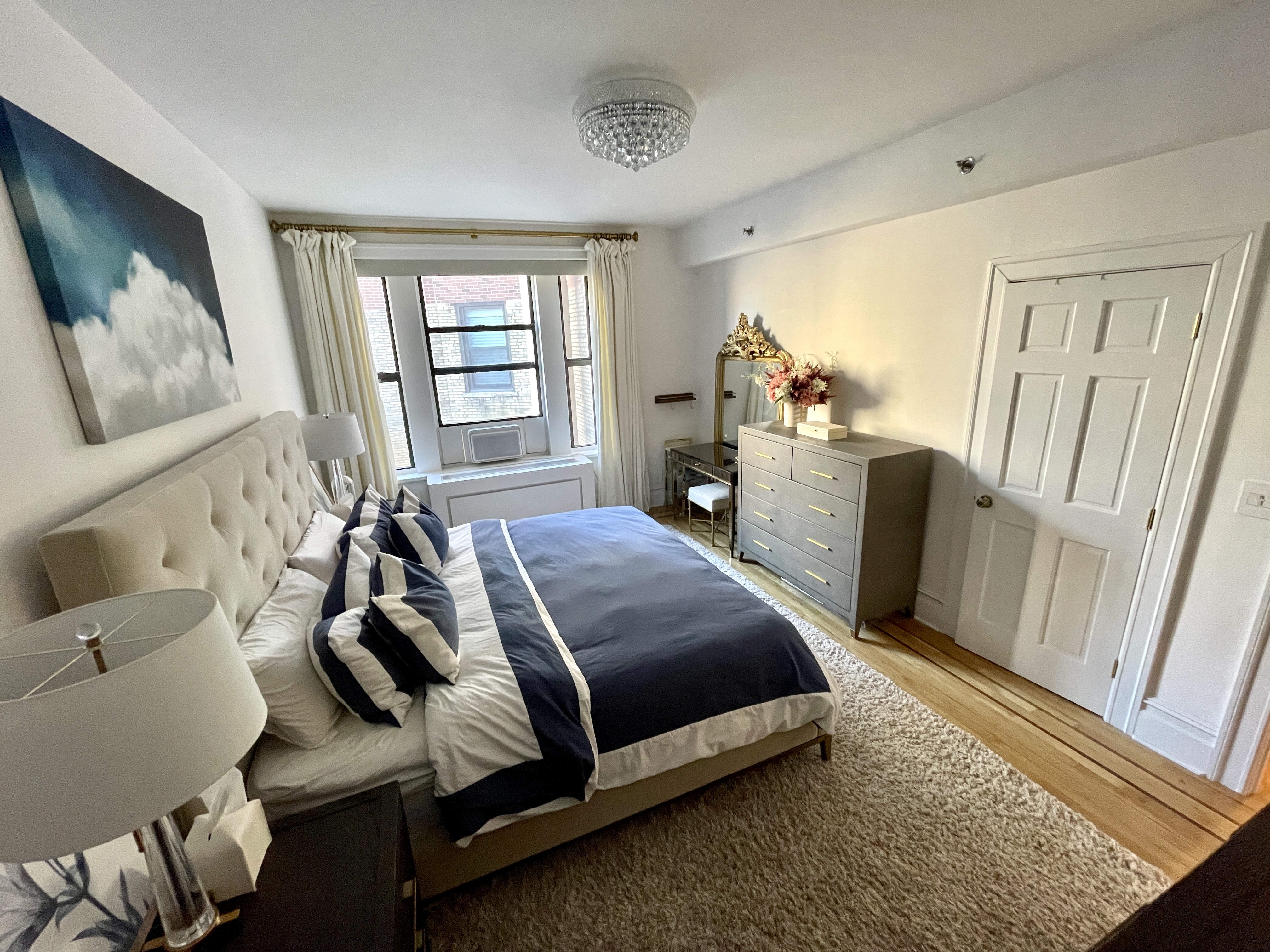203 West 90th Street, Unit 6B Manhattan, NY 10024 - Photo 20 of 22 a bed room with a bed and a window