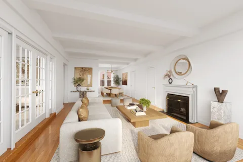 a living room with furniture a fireplace and a floor to ceiling window