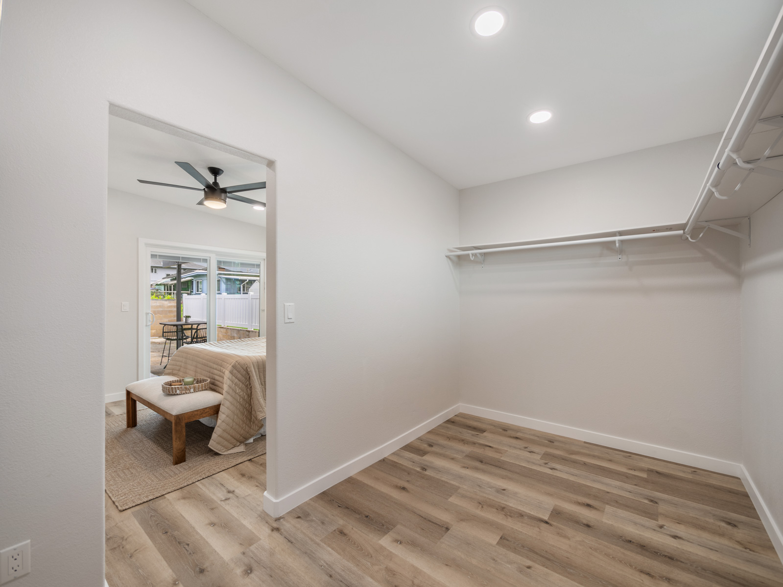 45-561 Paleka Road, Unit C Kaneohe, HI 96744 - Photo 15 of 27 a view of a room with wooden floor cabinet and a bathroom