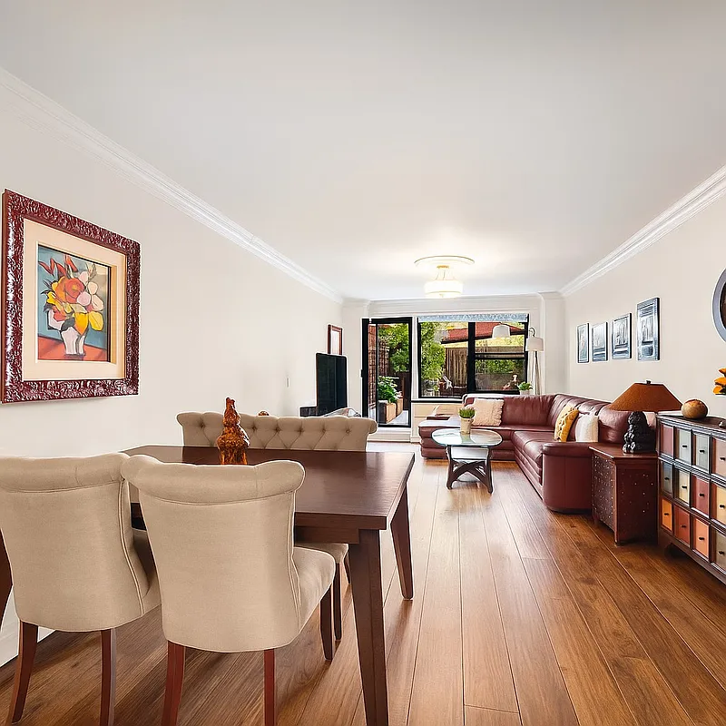 301 East 62nd Street, Unit 2K Manhattan, NY 10065 - Photo 2 of 9 a living room with fireplace furniture and a wooden floor