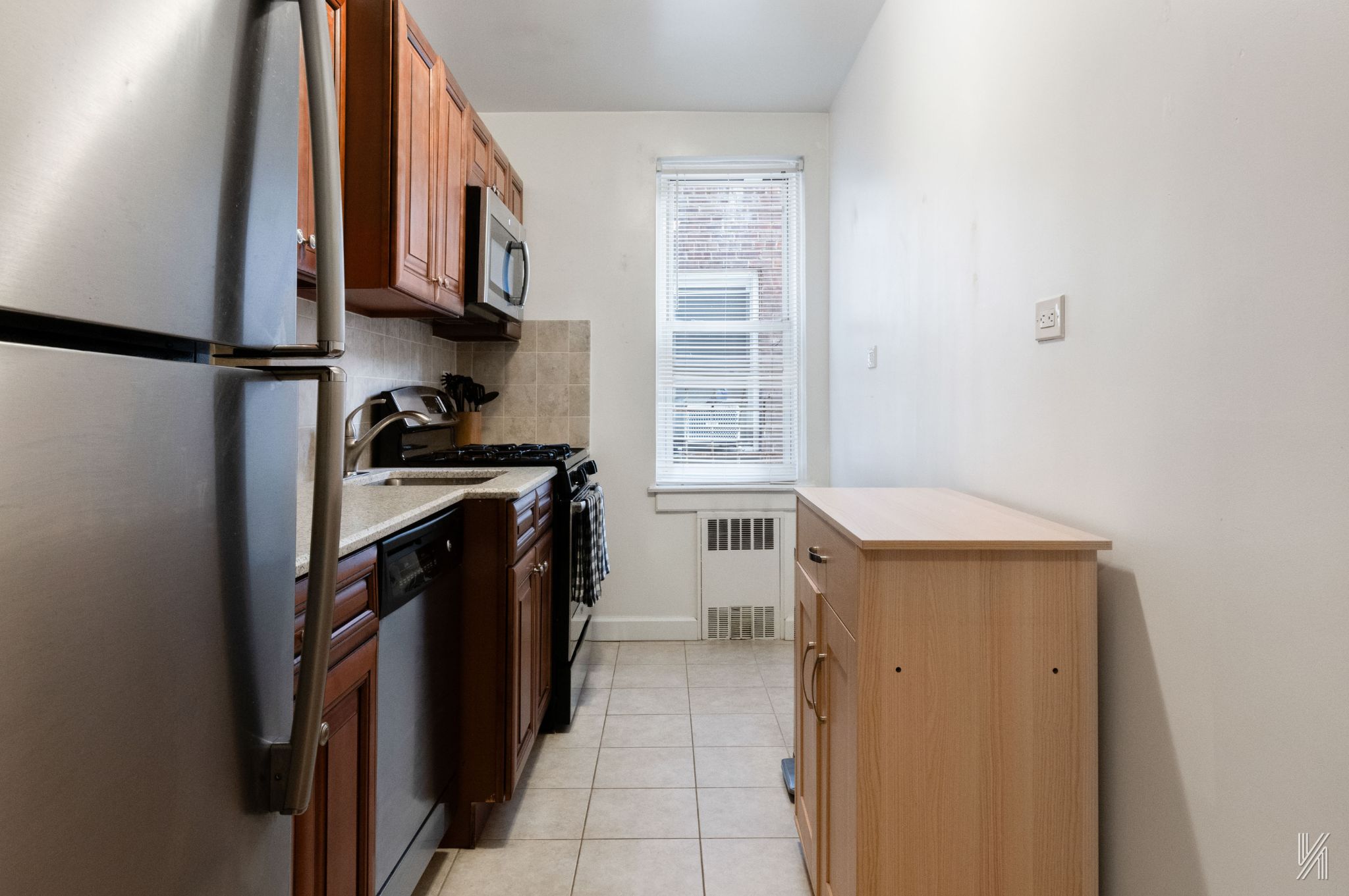 39-55 51st Street, Unit 3G Queens, NY 11377 - Photo 8 of 18 a utility room with cabinets washer and dryer