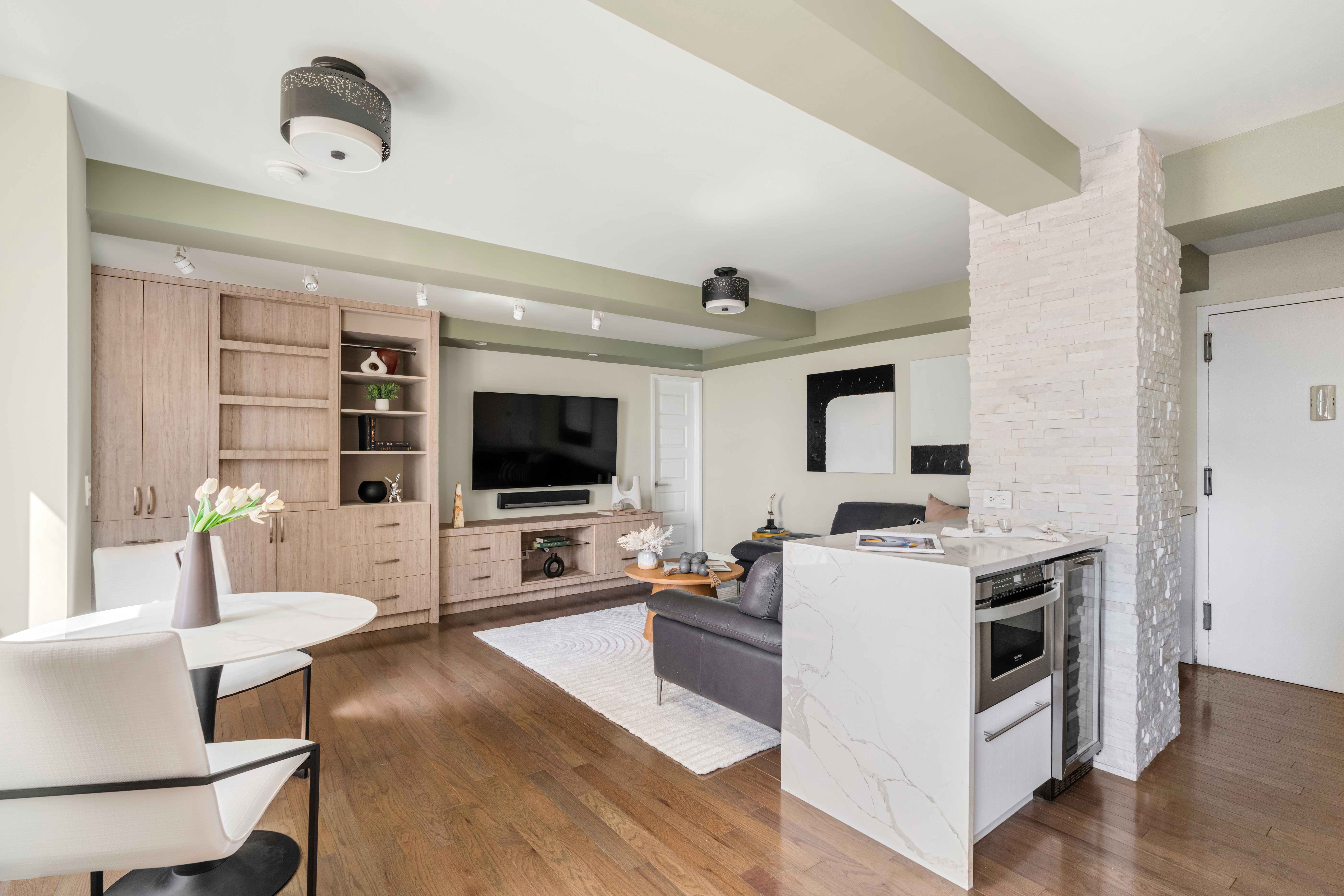 111 Hicks Street, Unit 16LM Brooklyn, NY 11201 - Photo 2 of 16 a living room with furniture and a flat screen tv