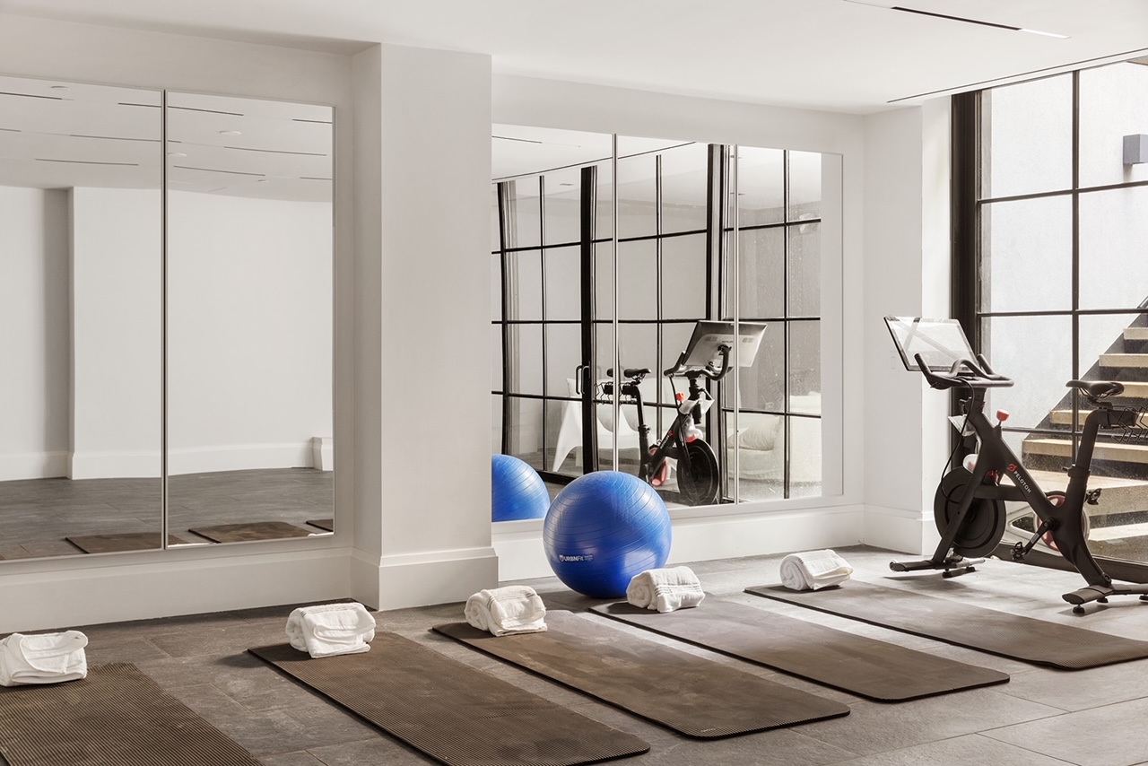 17 East 9th Street Manhattan, NY 10003 - Photo 26 of 32 a living room with a couch and white cabinets