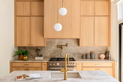 a kitchen with a refrigerator and cabinets