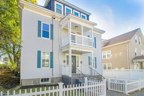 a front view of a house with a porch
