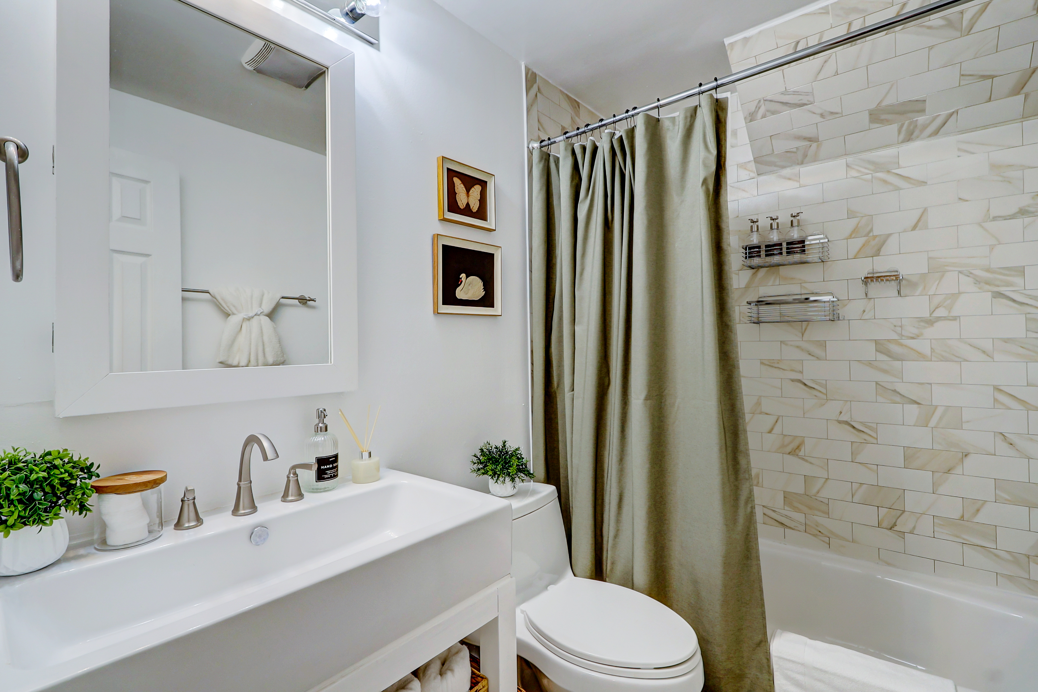 1003 P Street Northwest Washington, DC 20001 - Photo 20 of 34 a bathroom with a sink a toilet and shower