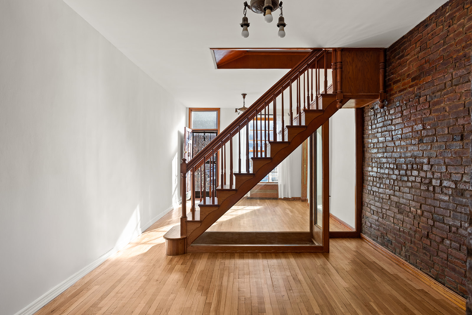 1682 8th Avenue Brooklyn, NY 11215 - Photo 5 of 16 a view of entryway with wooden floor