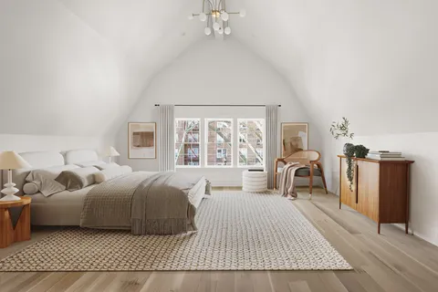 a bedroom with a bed dresser and a window