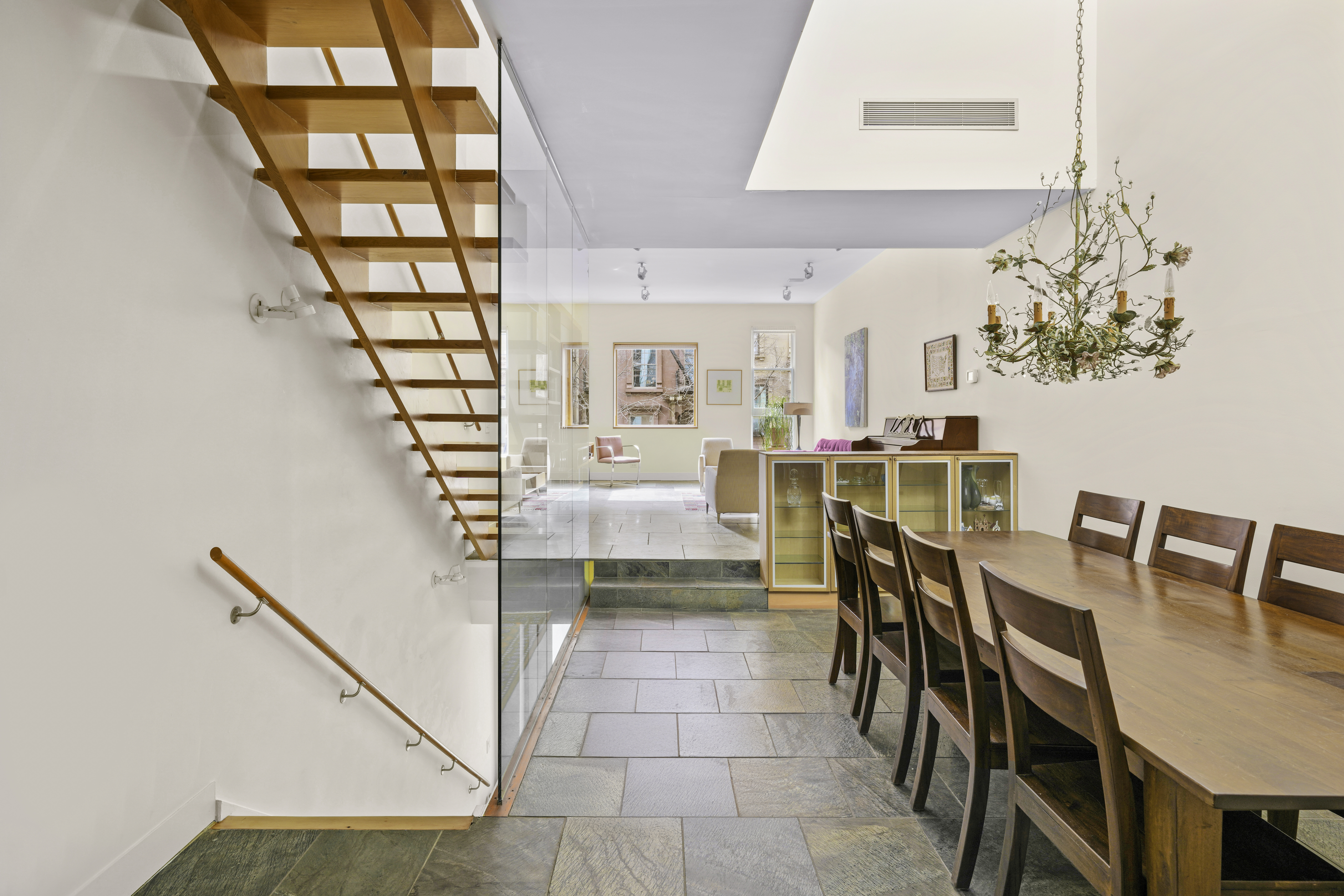 133 West 123rd Street Manhattan, NY 10027 - Photo 2 of 31 a dining room with furniture and chandelier