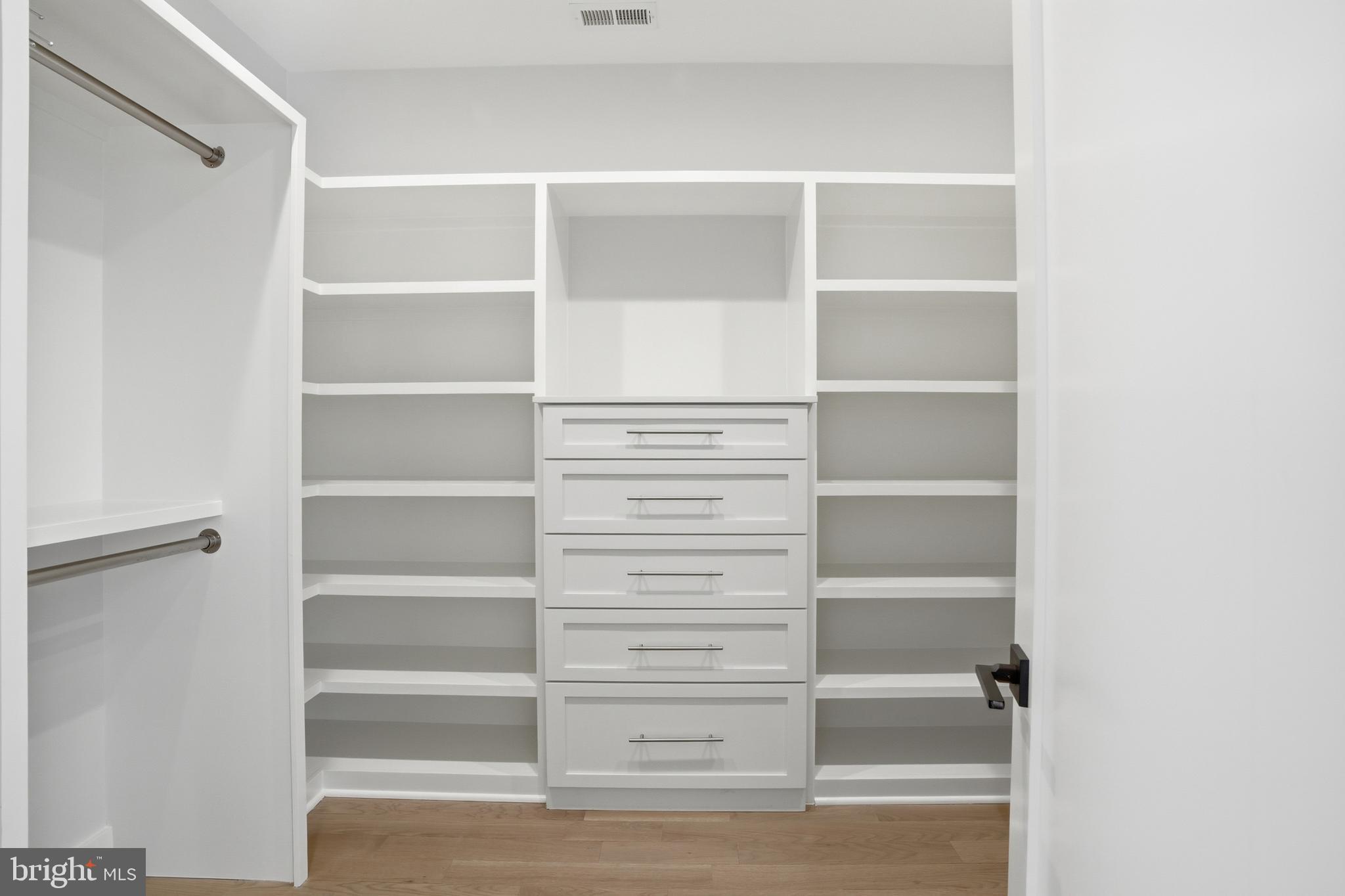 938 Saigon Road McLean, VA 22102 - Photo 52 of 107 a view of walk in closet with empty racks