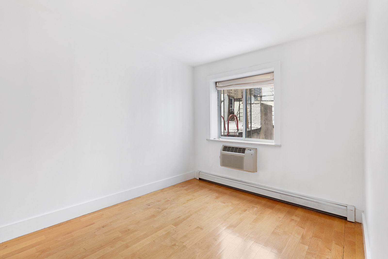 181 Hester Street, Unit 4A Manhattan, NY 10013 - Photo 4 of 8 an empty room with cabinet