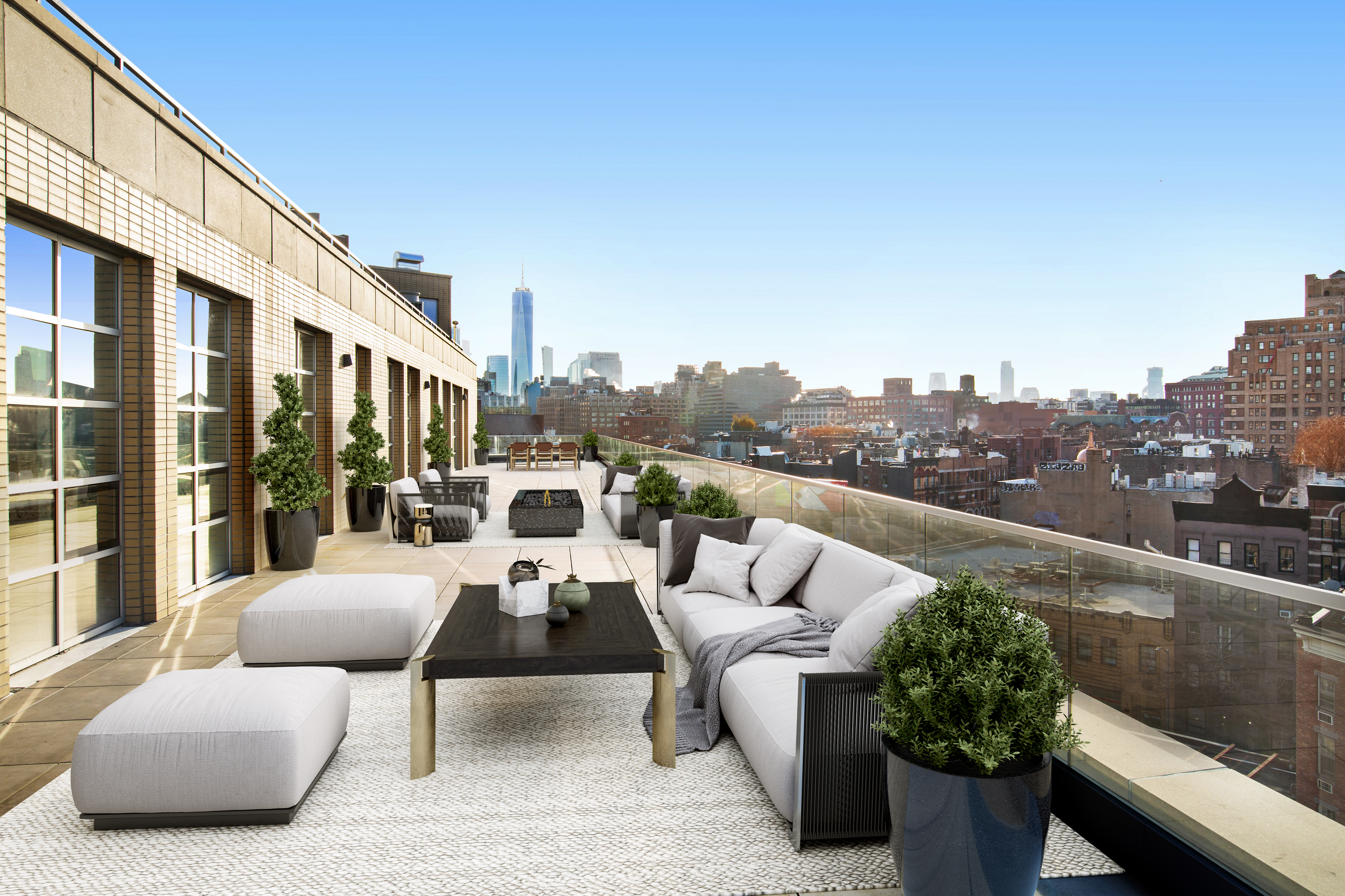 117 7th Avenue South, Unit PH Manhattan, NY 10014 - Photo 4 of 5 a roof deck with couches and potted plants