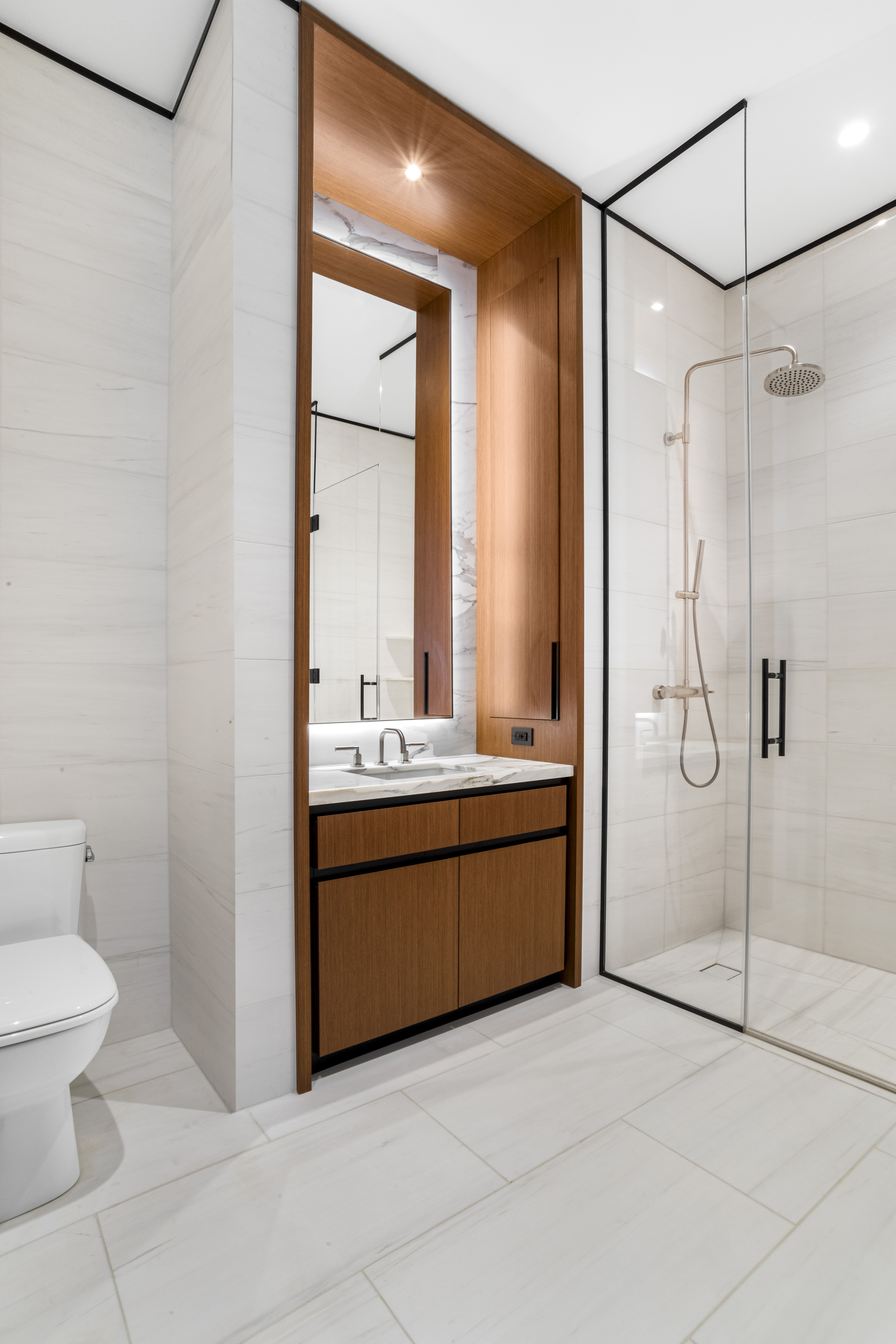 15 East 30th Street, Unit Undisclosed Manhattan, NY 10016 - Photo 8 of 23 a bathroom with a granite countertop sink a toilet and shower