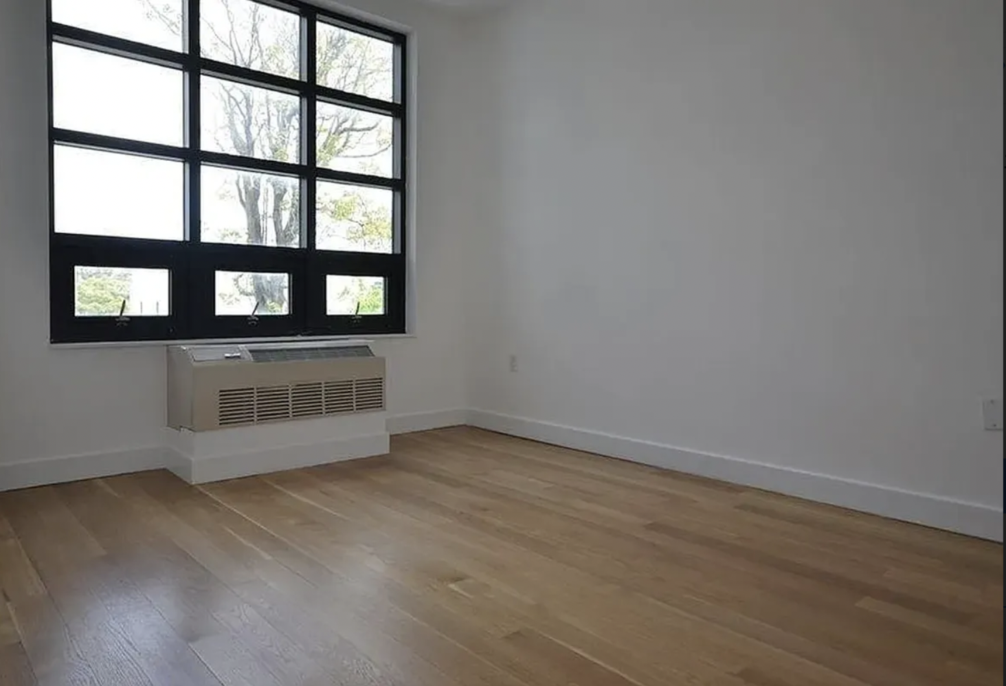 65 North 6th Street, Unit 3D Brooklyn, NY 11249 - Photo 4 of 7 a view of an empty room with a window